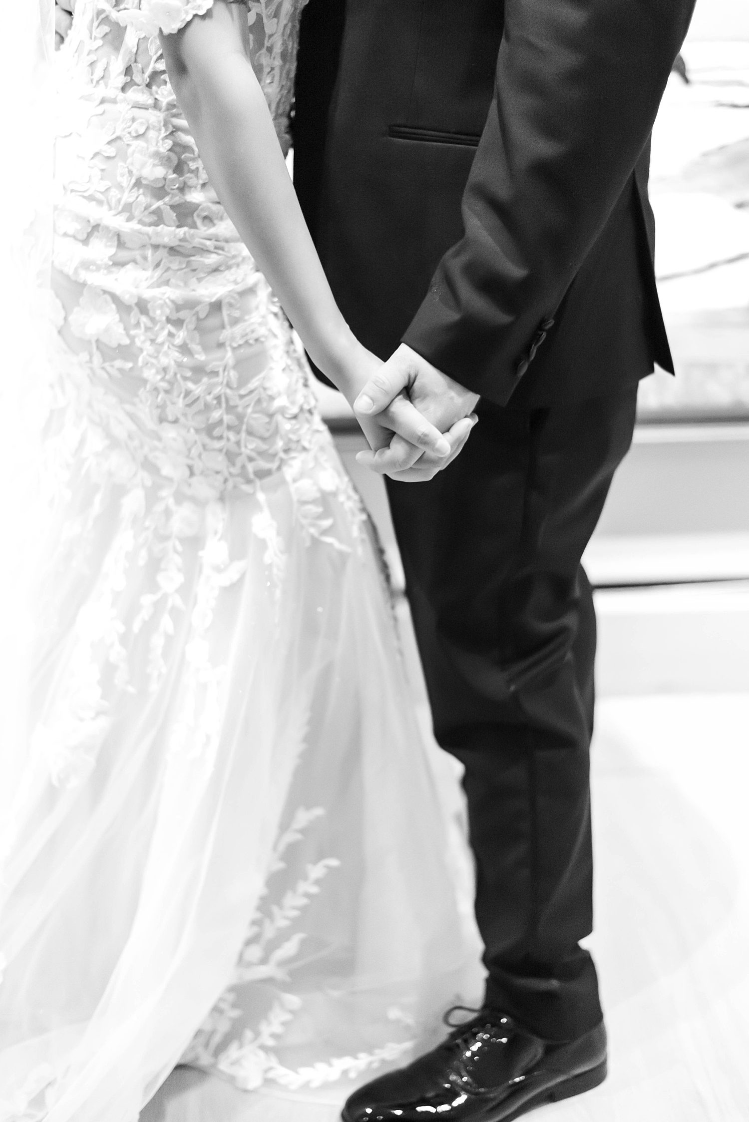 bride and groom hold hands during FL wedding day