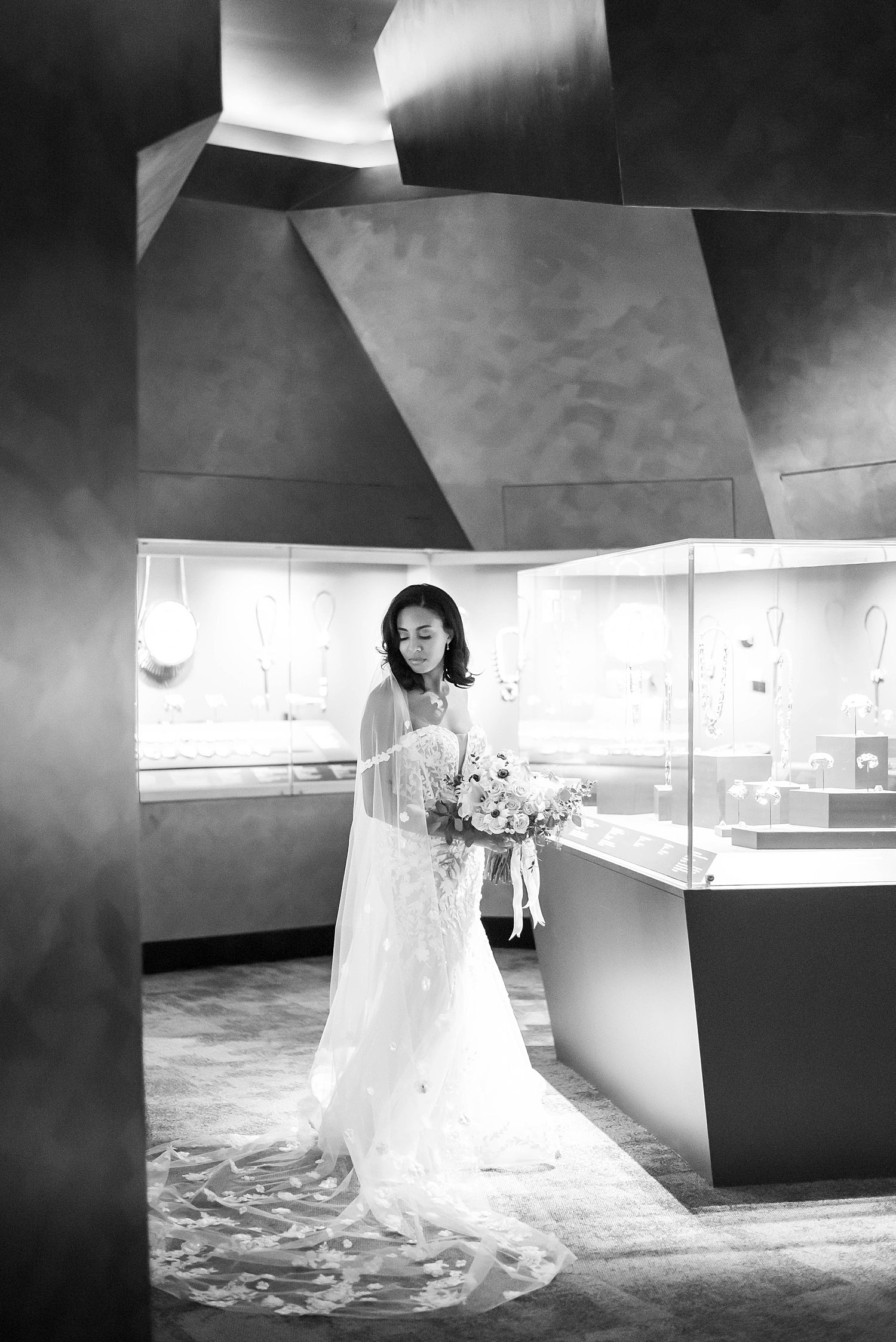 bride poses among displays during Florida wedding day in museum