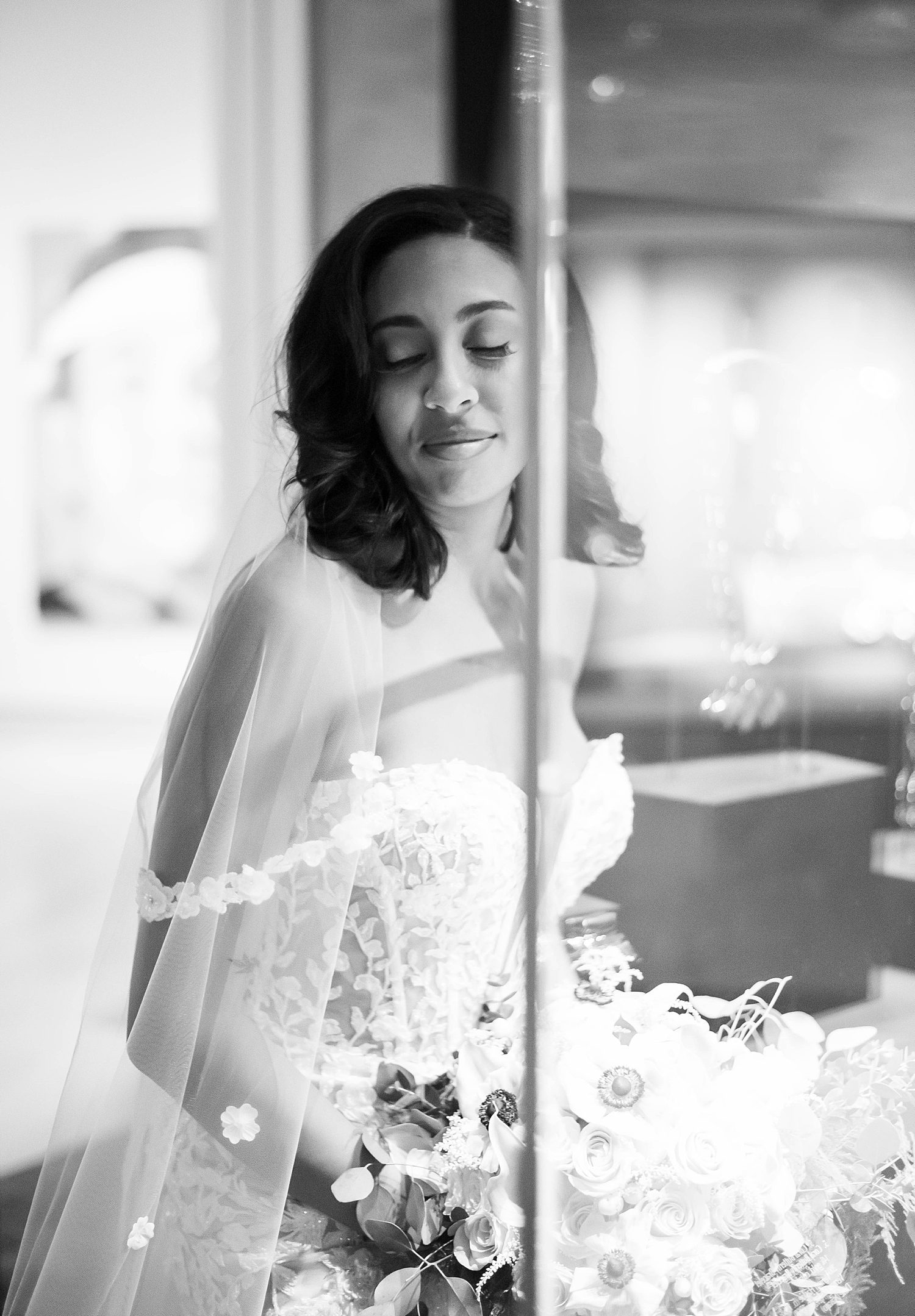 bride poses by art display in The James Museum