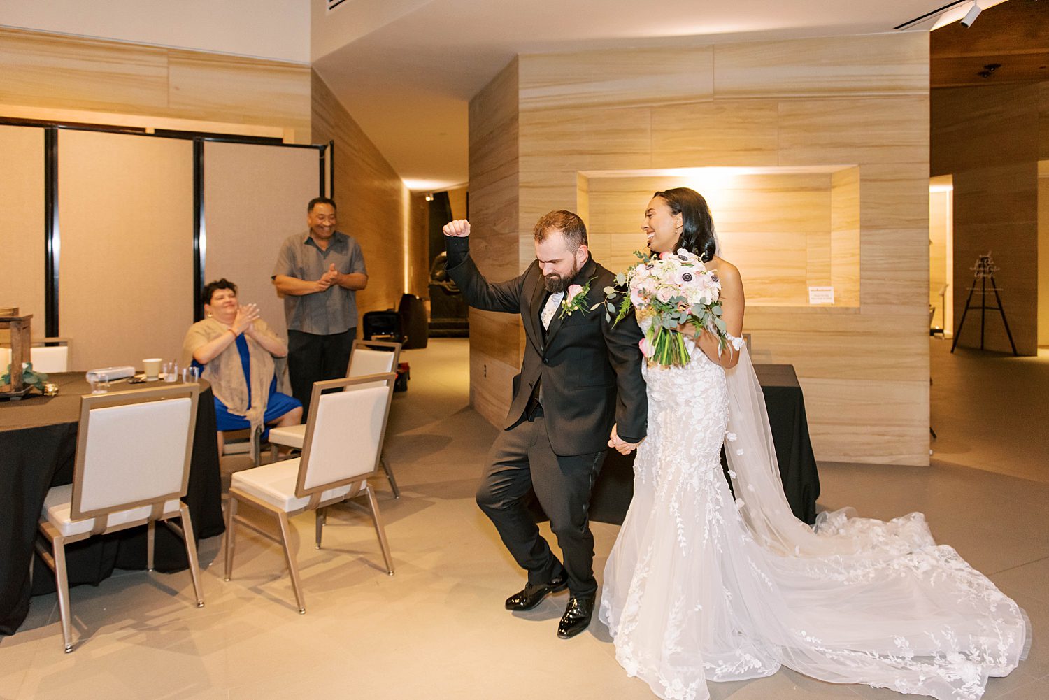 newlyweds dance walking into reception at The James Museum