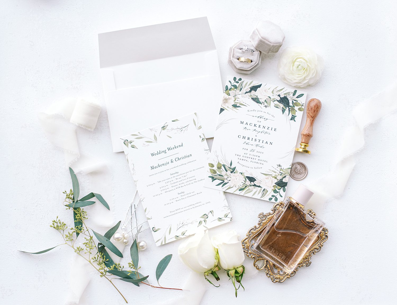 summer invitation suite with wax seal and white flowers
