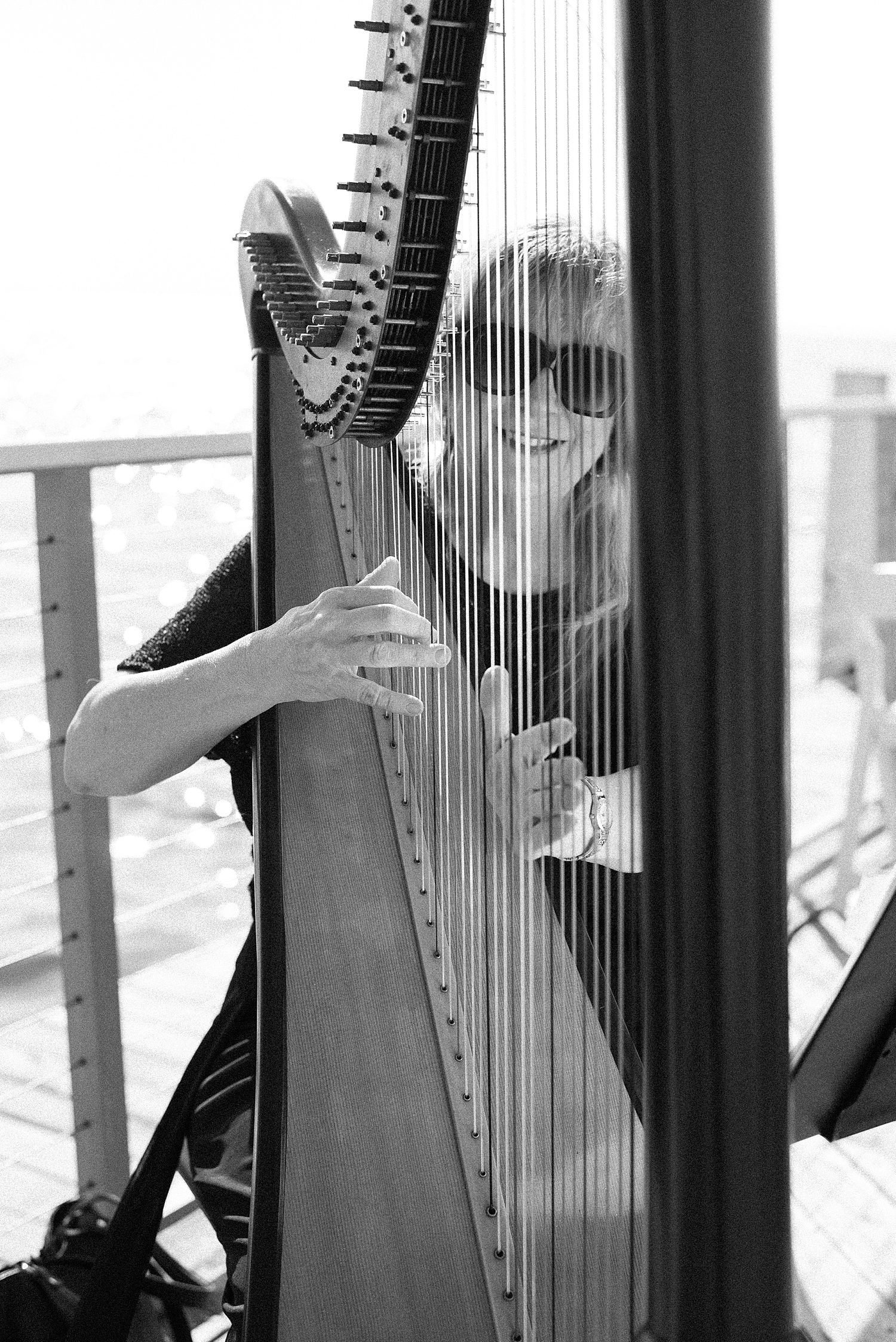 harpist smiles behind instrument