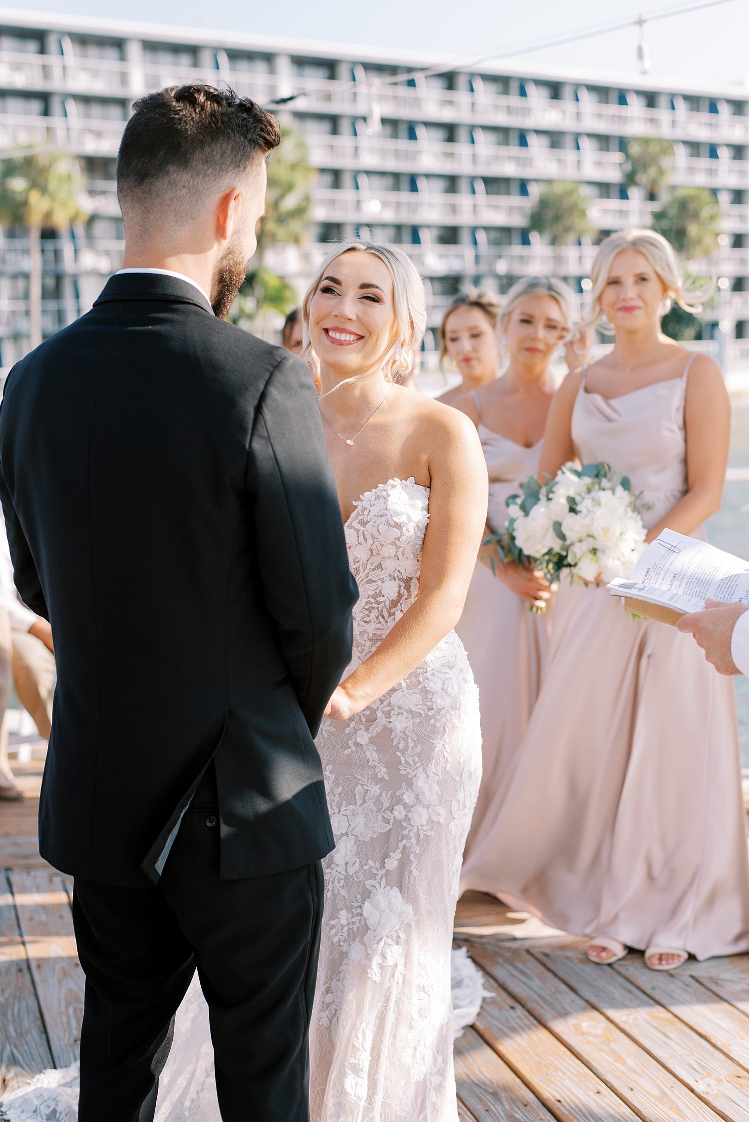 bride smiles up at groom during The Godfrey wedding ceremony