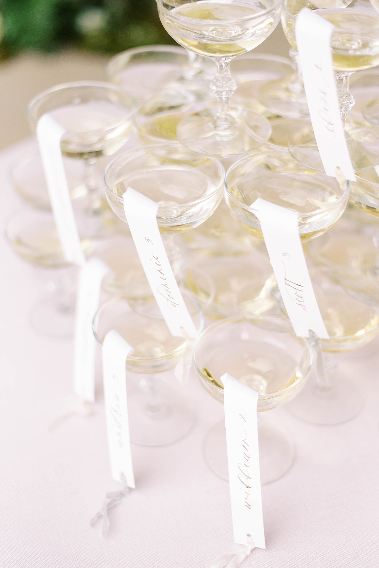 champagne glasses with tags for wedding reception 