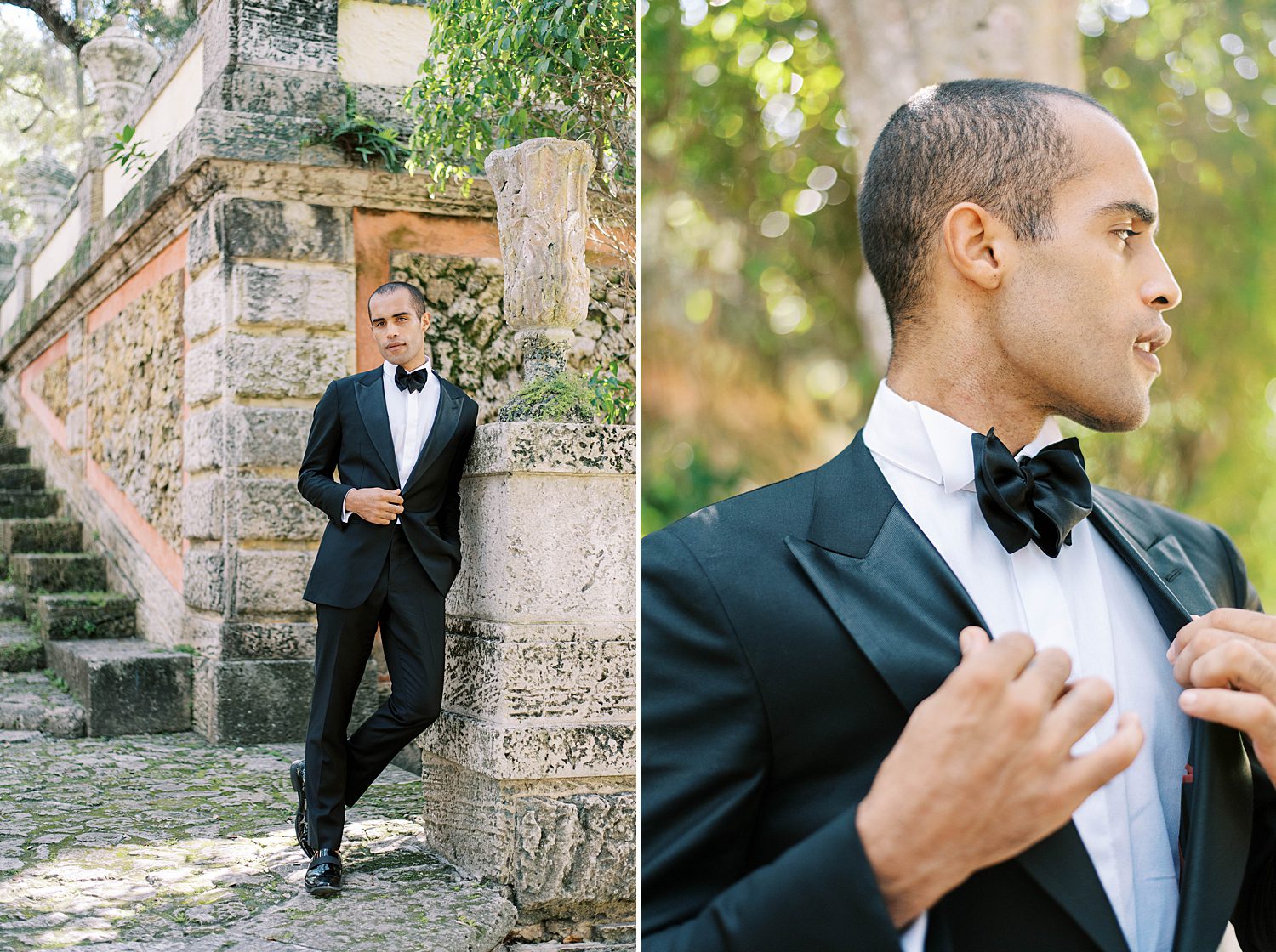 groom in black suit with bowtie leans against stone wall at Vizcaya Museum