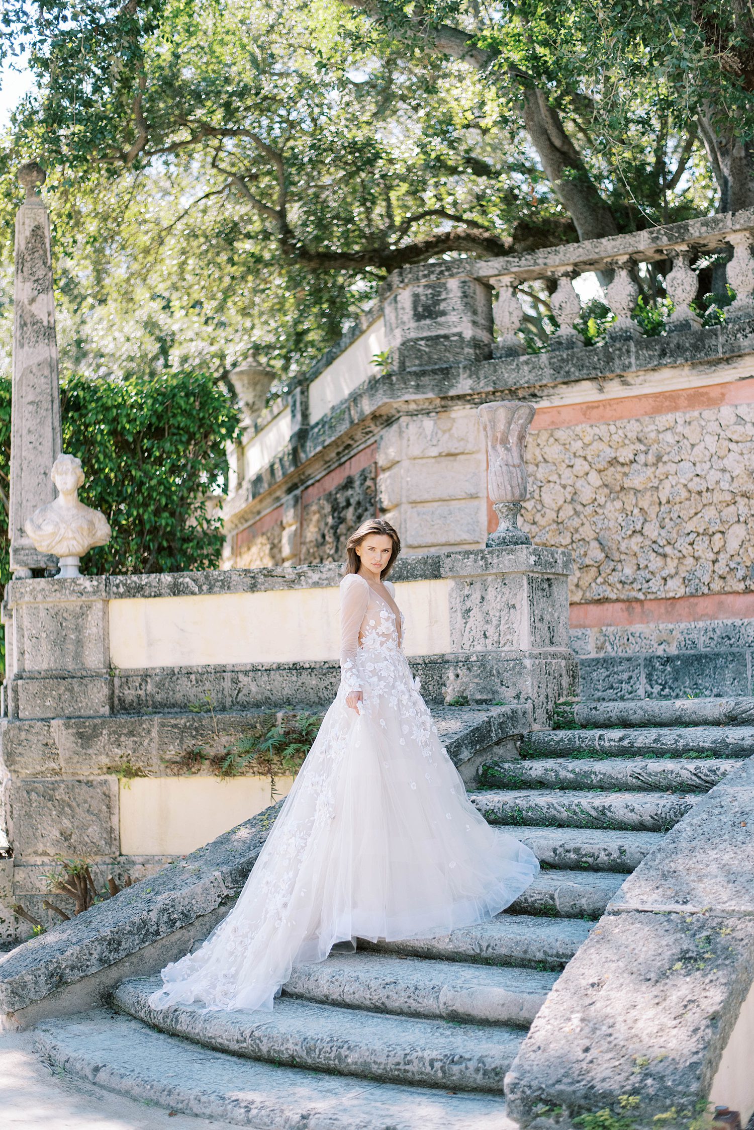 bride walks up steps at Vizcaya Museum