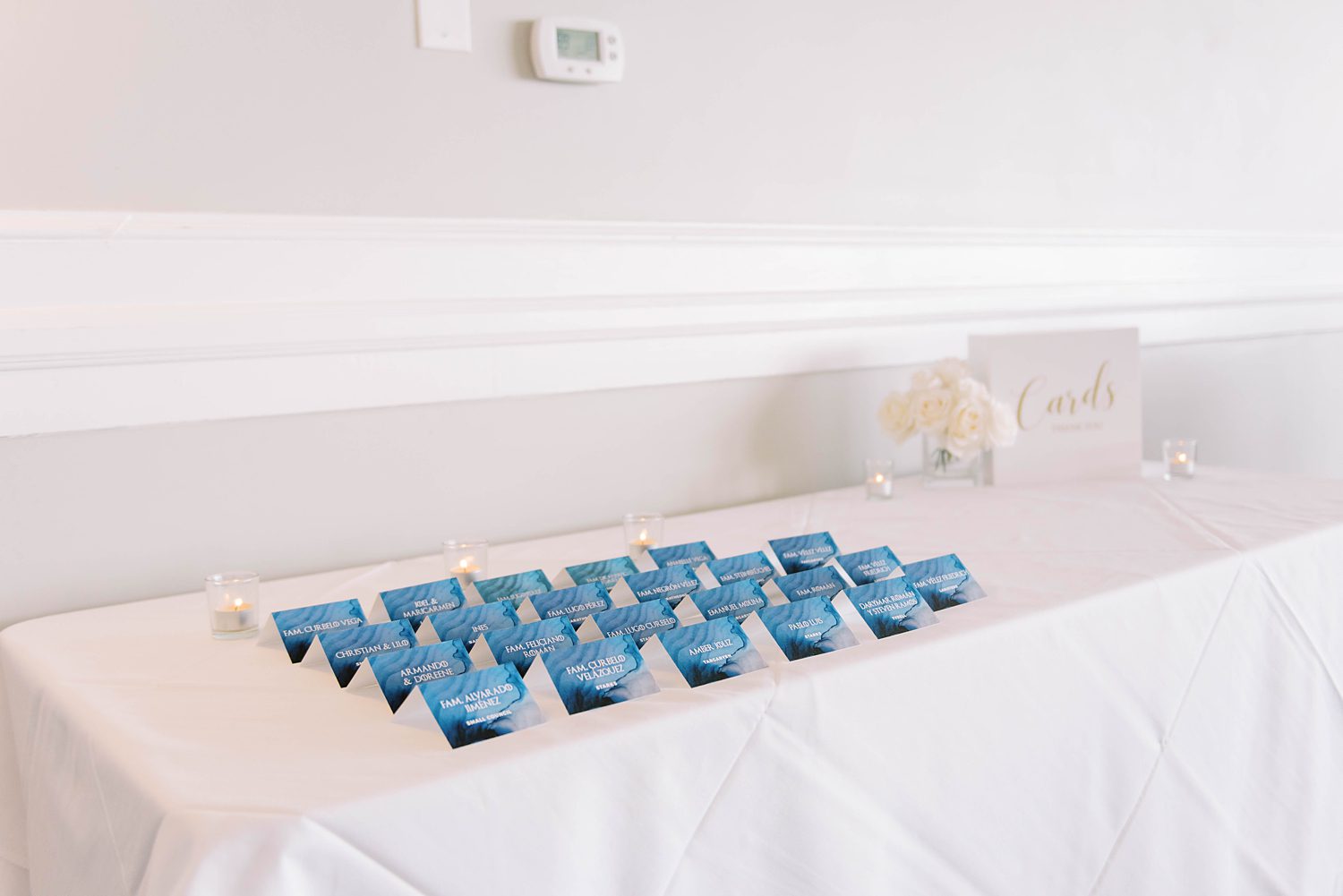 navy seating cards at Rusty Pelican for wedding reception 