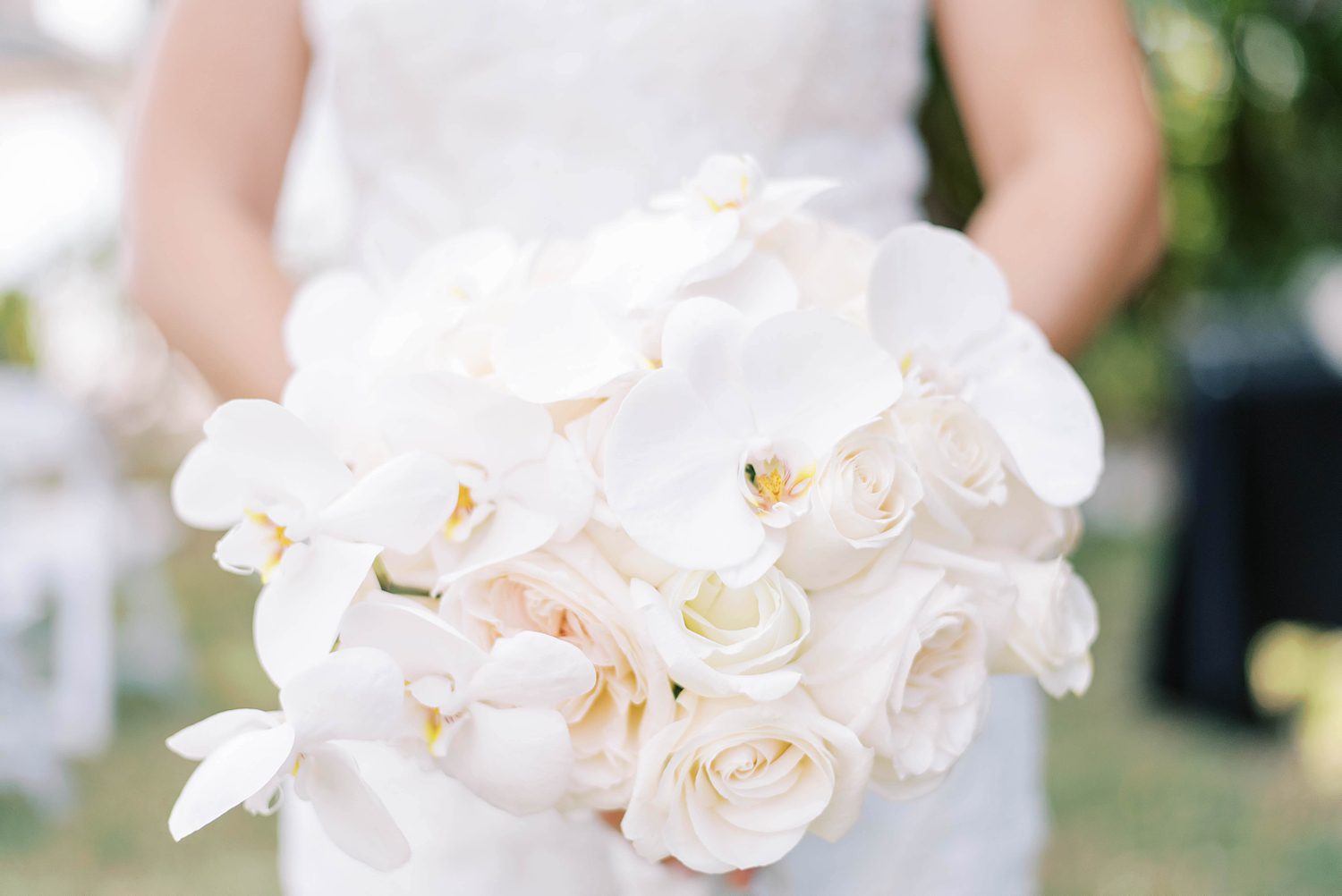 bride's all-white wedding bouquet for Harborside Chapel wedding