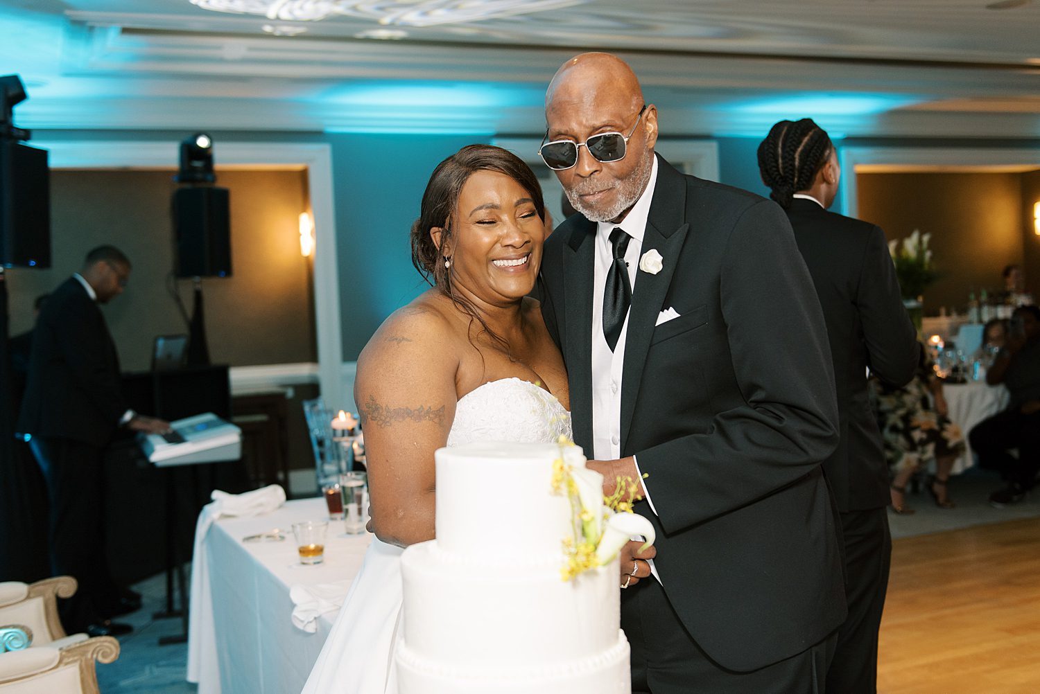 bride and groom smile during wedding reception inside the Hyatt Clearwater