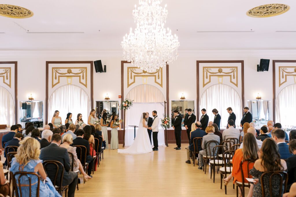 centro asturiano de tampa wedding ceremony bride and groom holding hands 