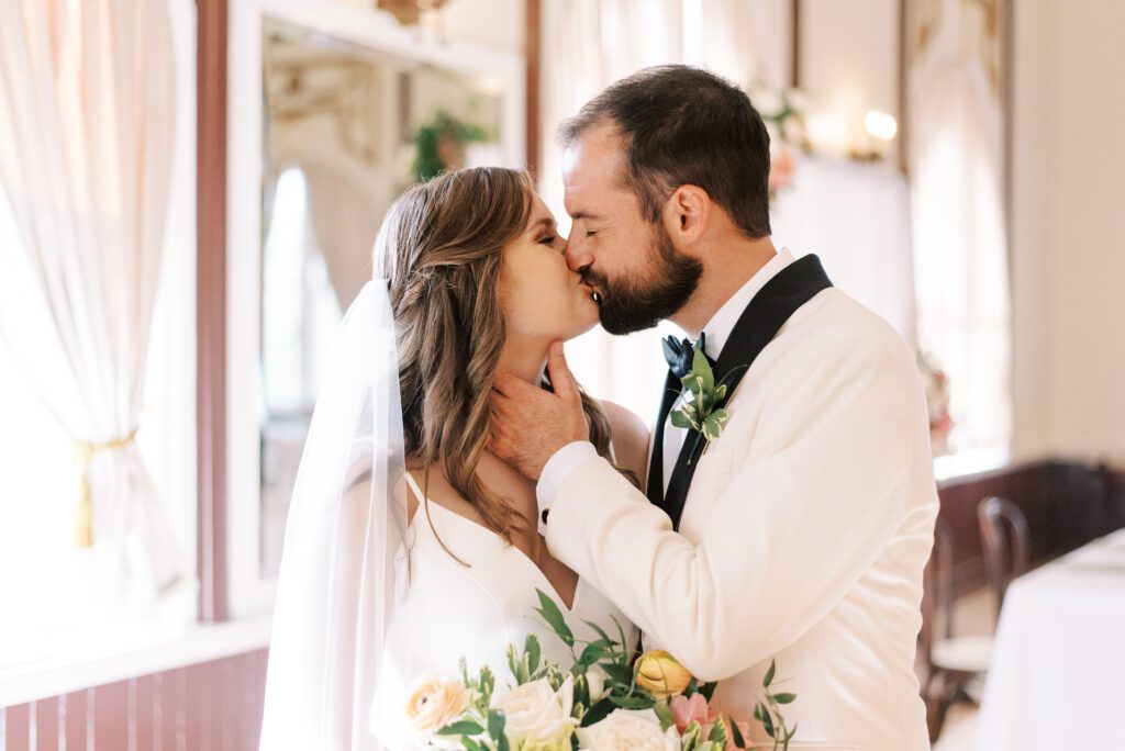 bride and groom kissing at centro asturiano de tampa wedding