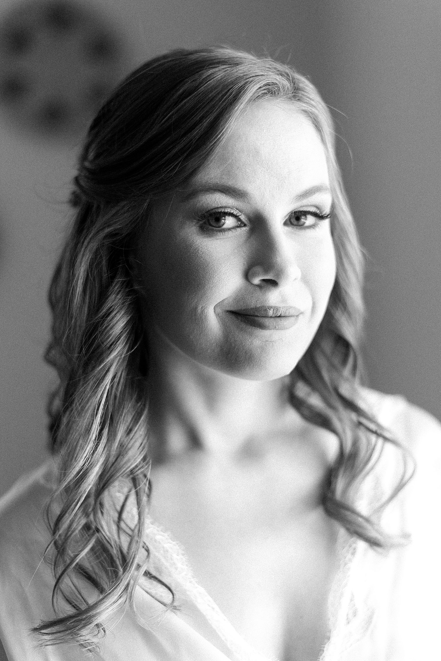 black and white portrait of bride with curled hair 