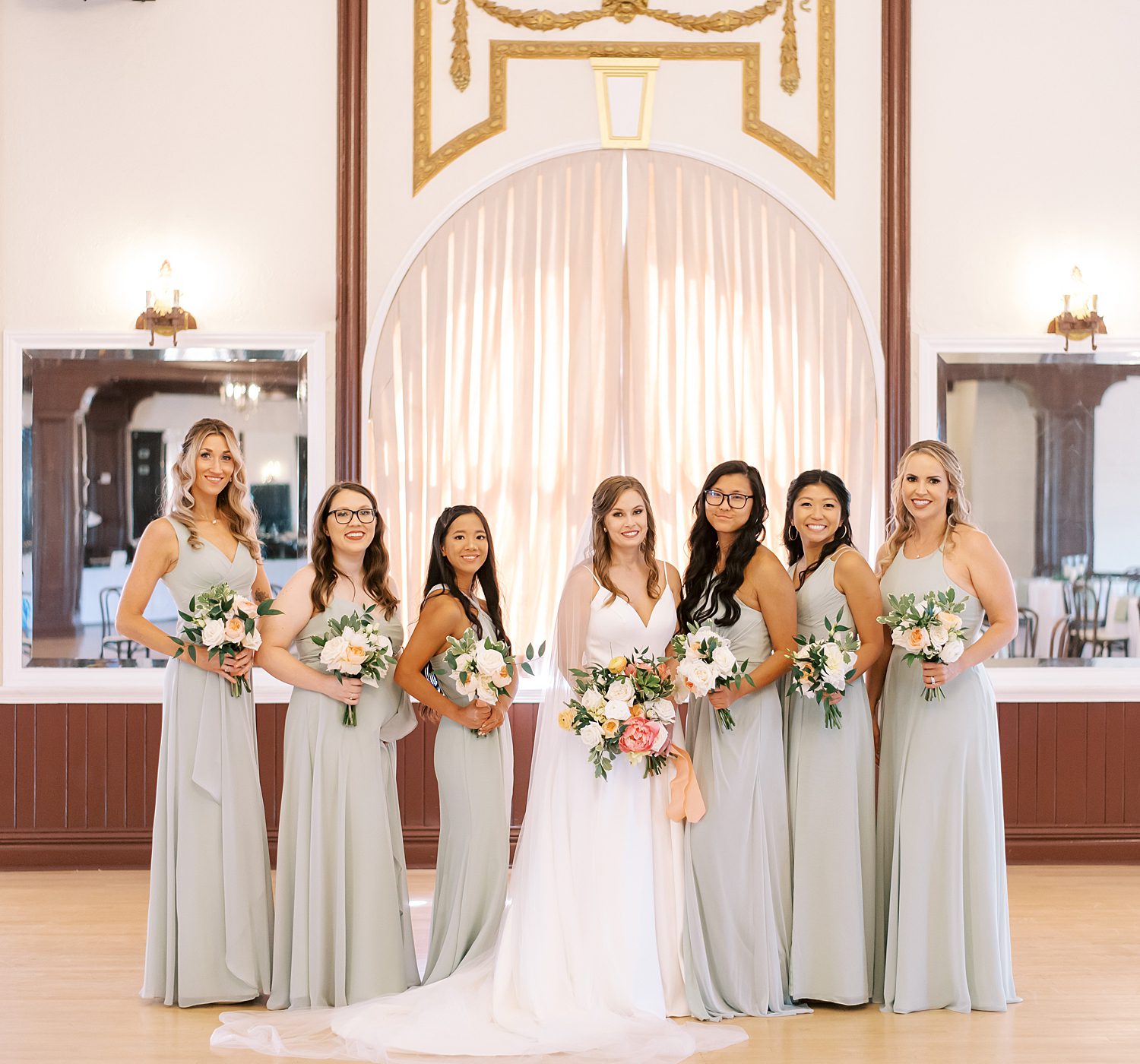 bride roses with bridesmaids in light green gowns at Centro Asturiano de Tampa