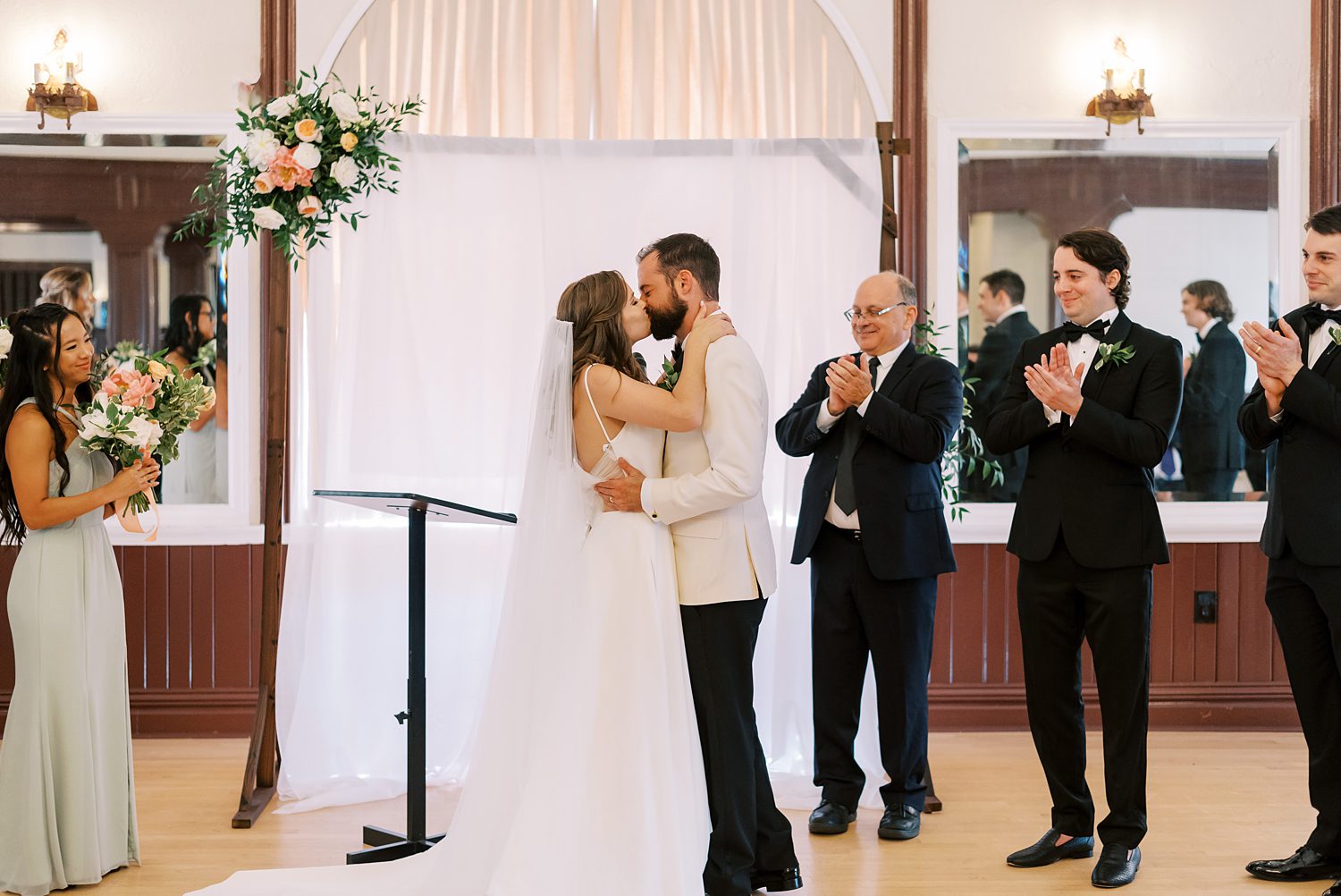 bride and groom kiss after wedding ceremony at Centro Asturiano de Tampa