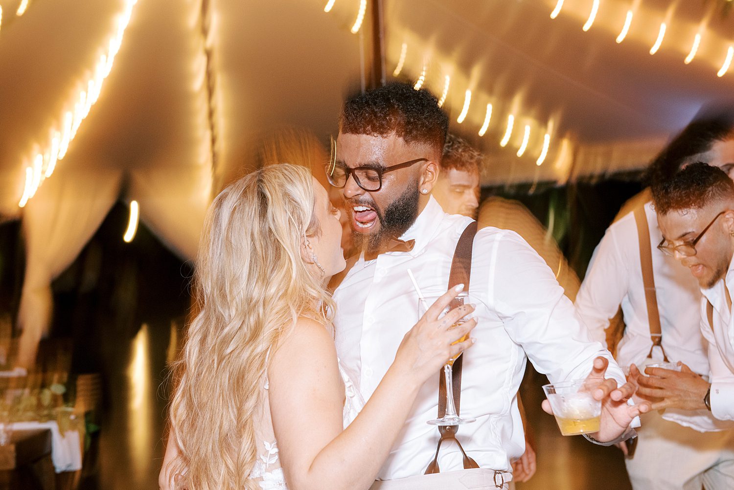 bride and groom dance under tent at Mill Pond Estate