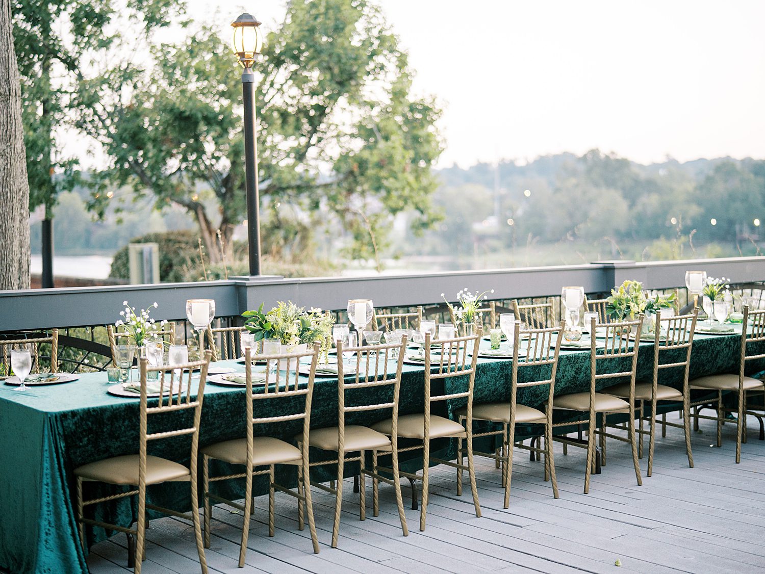 wedding reception on patio of The Bibb Mill Event Center with teal velvet table cloths 