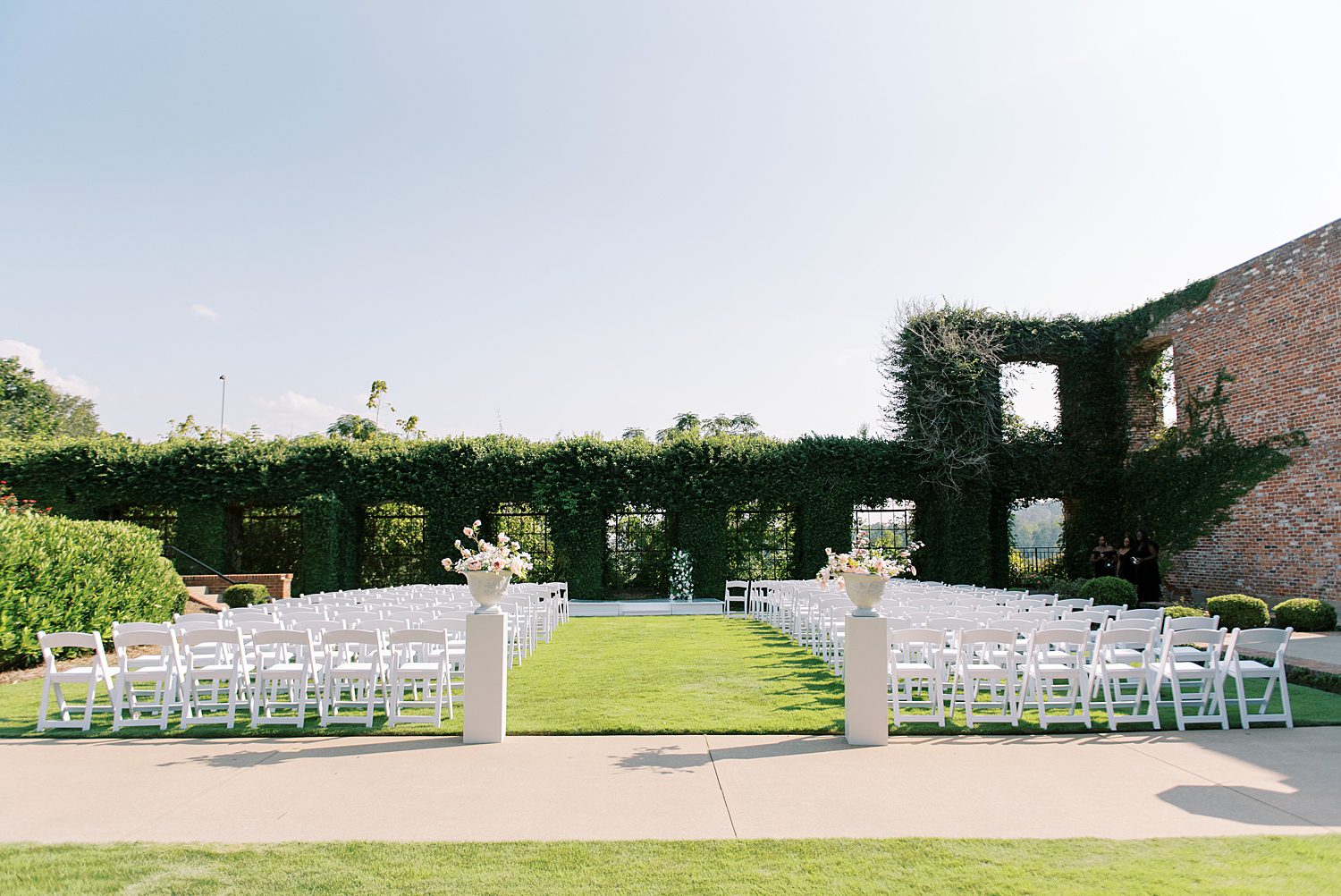 The Bibb Mill Event Center wedding on lawn with white seats 