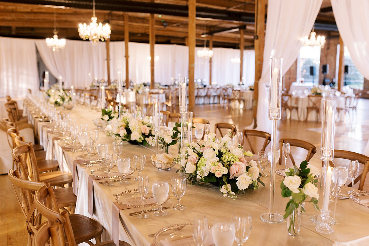 wedding reception with ivory and pink flower centerpieces in Columbus GA