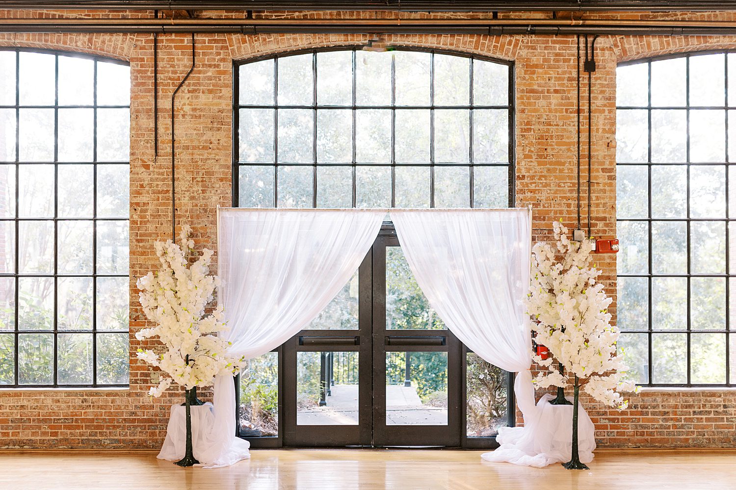 white curtains outline door at The Bibb Mill Event Center