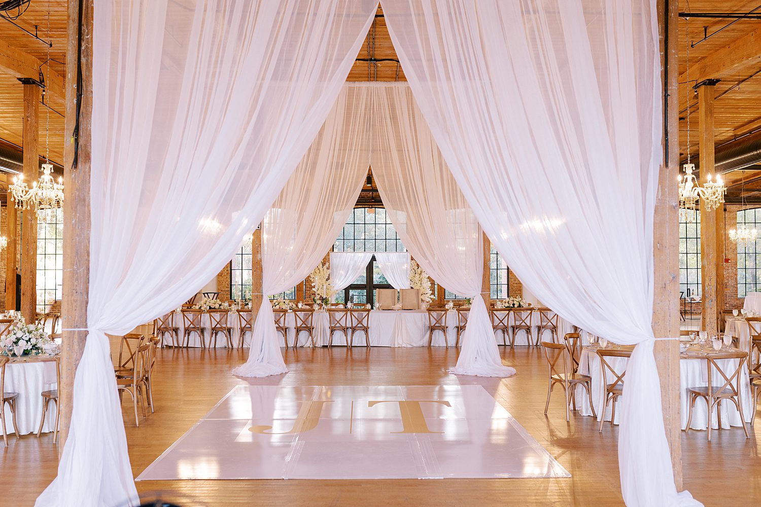 dance floor under white curtains at The Bibb Mill Event Center 