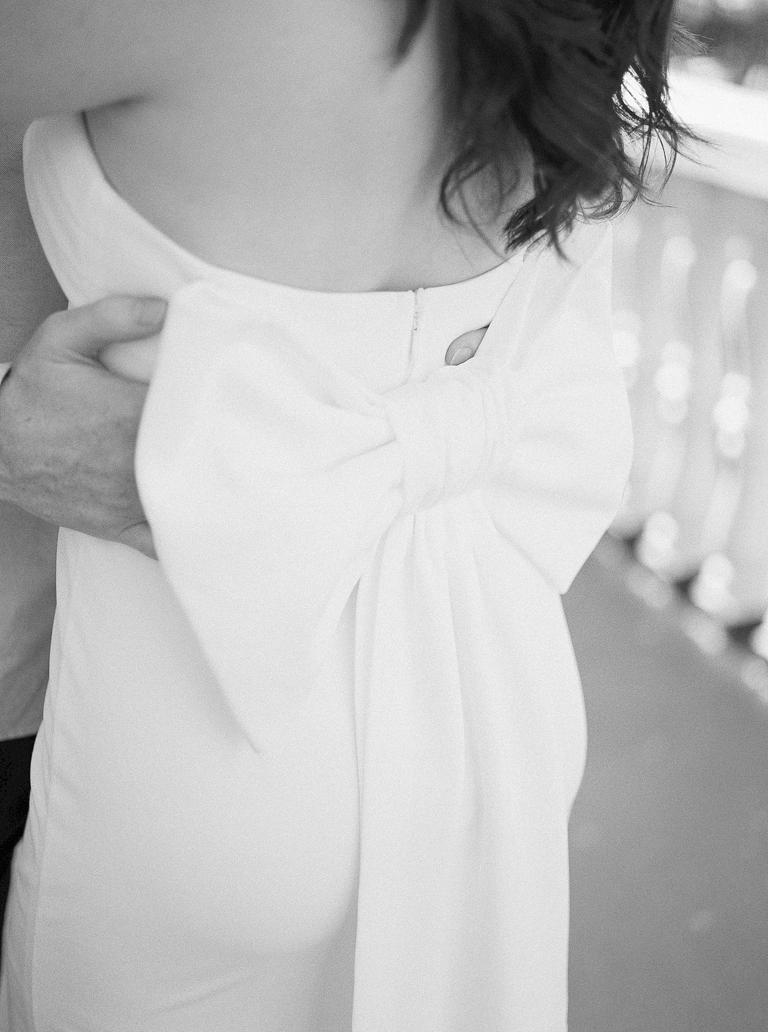bow on back of white dress for bride in Tampa FL