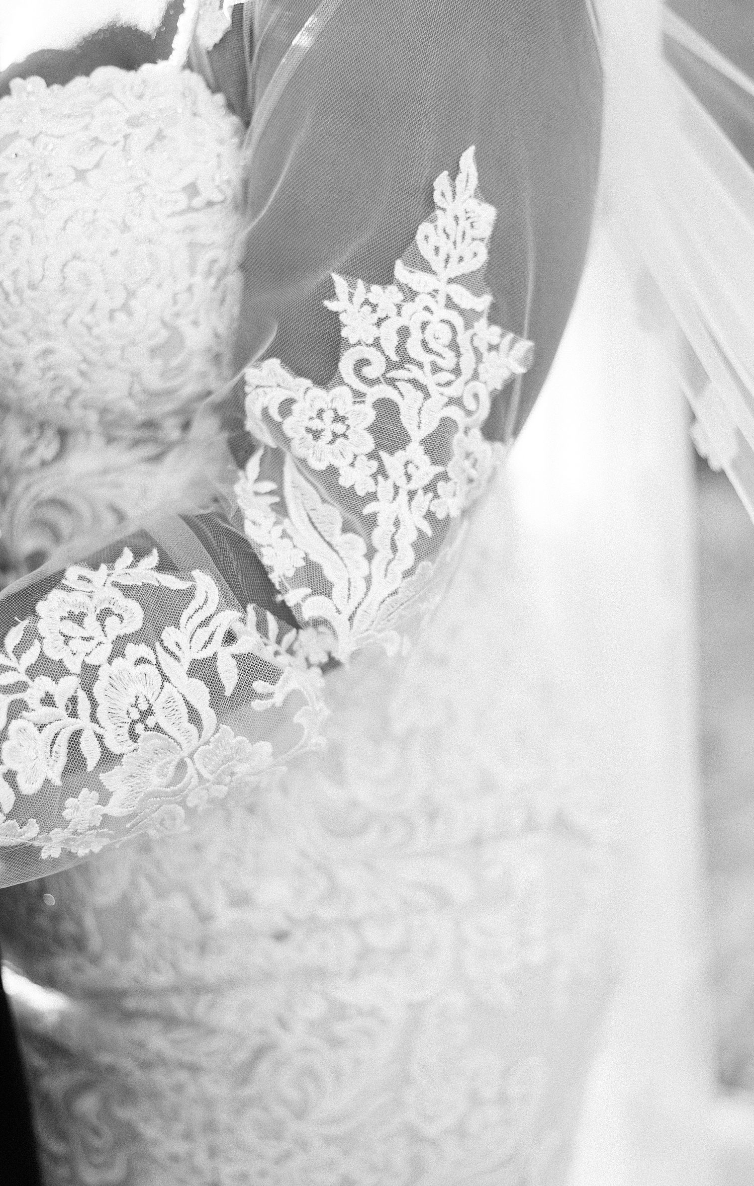 lace detailing on bride's wedding dress sleeve 