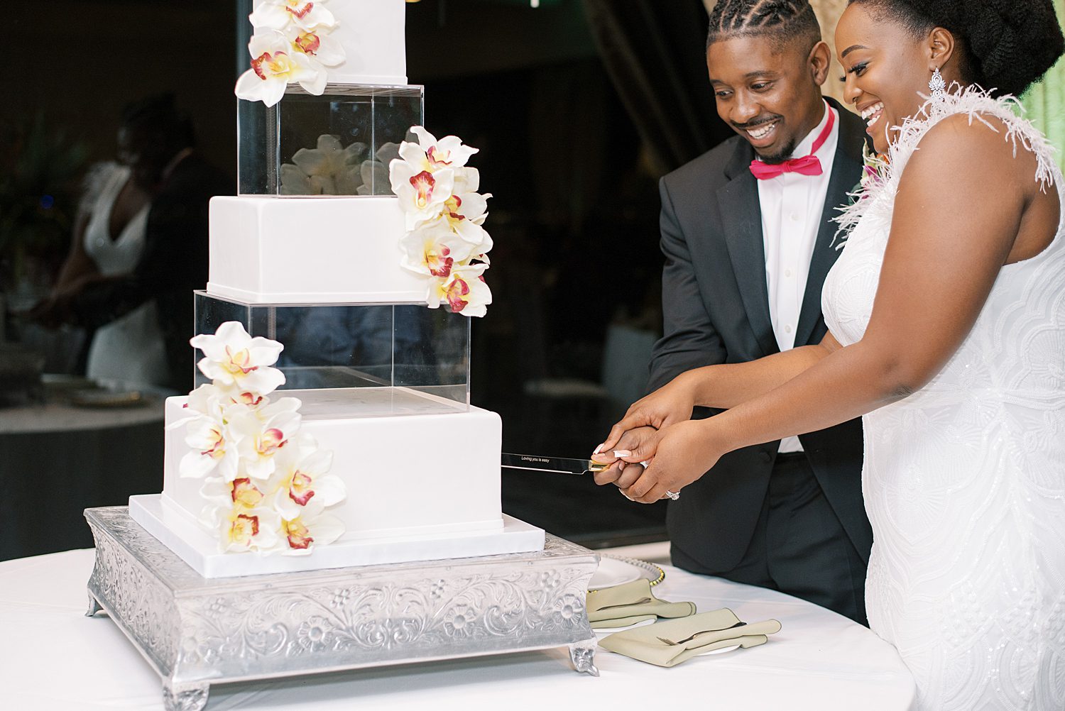 newlyweds cut wedding cake at The Rusty Pelican Tampa