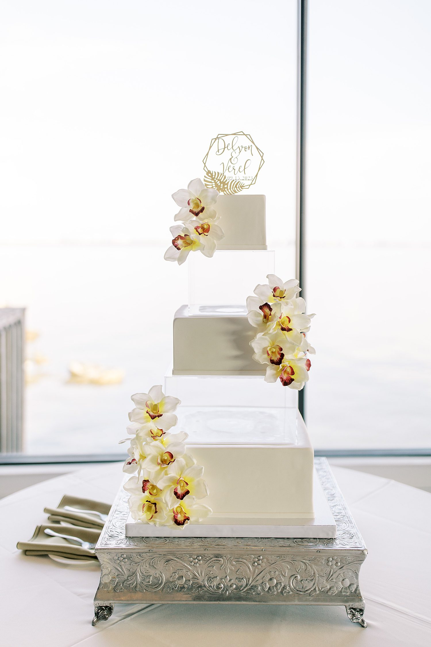 tiered wedding cake with orchids for FL wedding reception 
