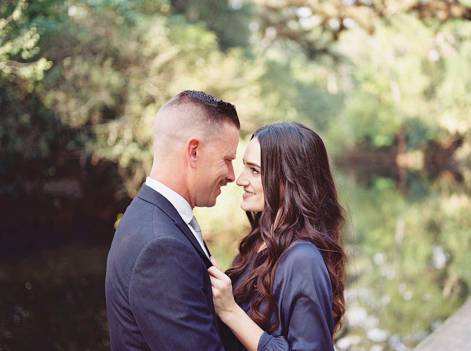 engaged couple Lenas heads together nuzzling noses in Hillsborough River State Park
