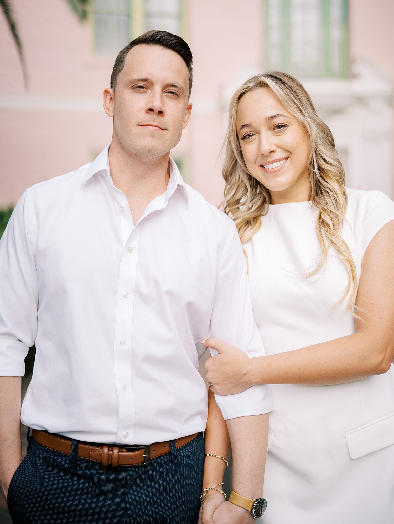 engaged couple holds hands during portraits at Tampa Museum of Fine Arts