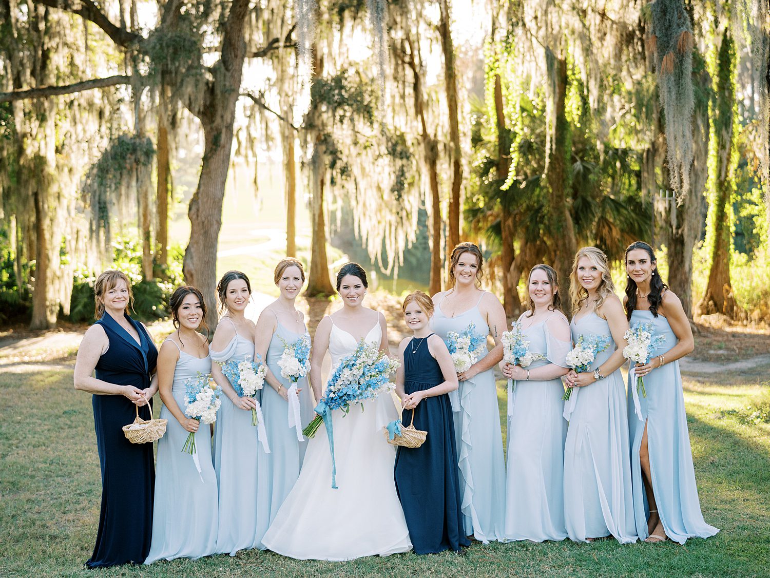 bride poses with flower girls, bridesmaids and maid of honor at Innisbrook Resort