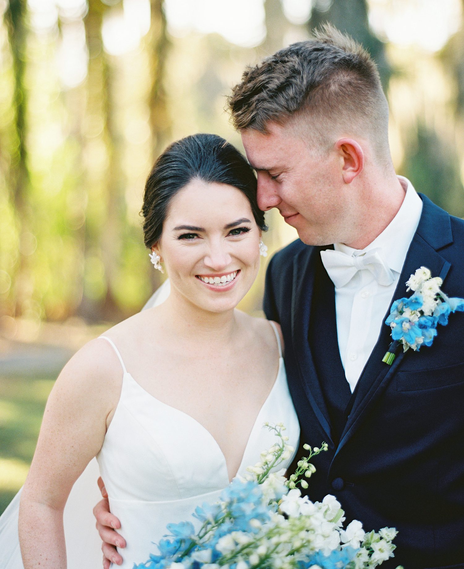 groom smiles down at bride during summer Innisbrook Resort wedding