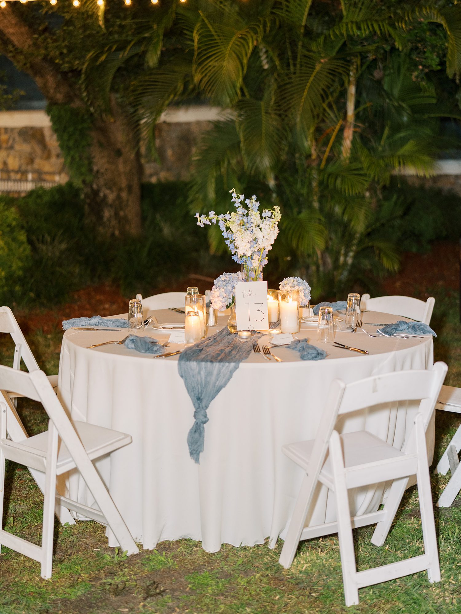 blue and white floral centerpieces for summer wedding reception at open air reception at Innisbrook Resort