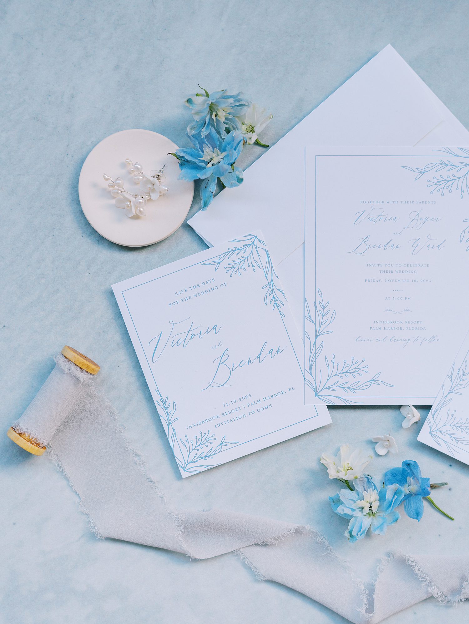 blue and white invitation suite for summer wedding day at open air reception at Innisbrook Resort