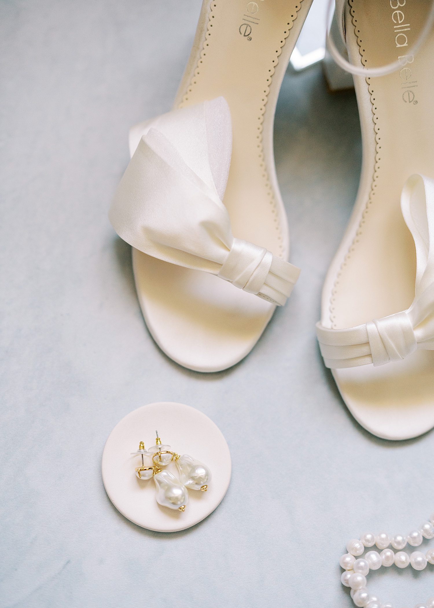 bride's Ivory shoes and pearl earrings for Florida wedding