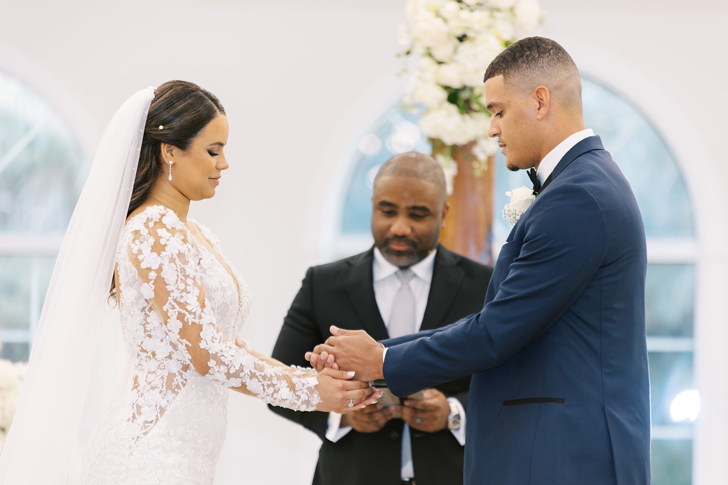 newlyweds exchange vows during wedding ceremony at Harborside Chapel in Tampa FL