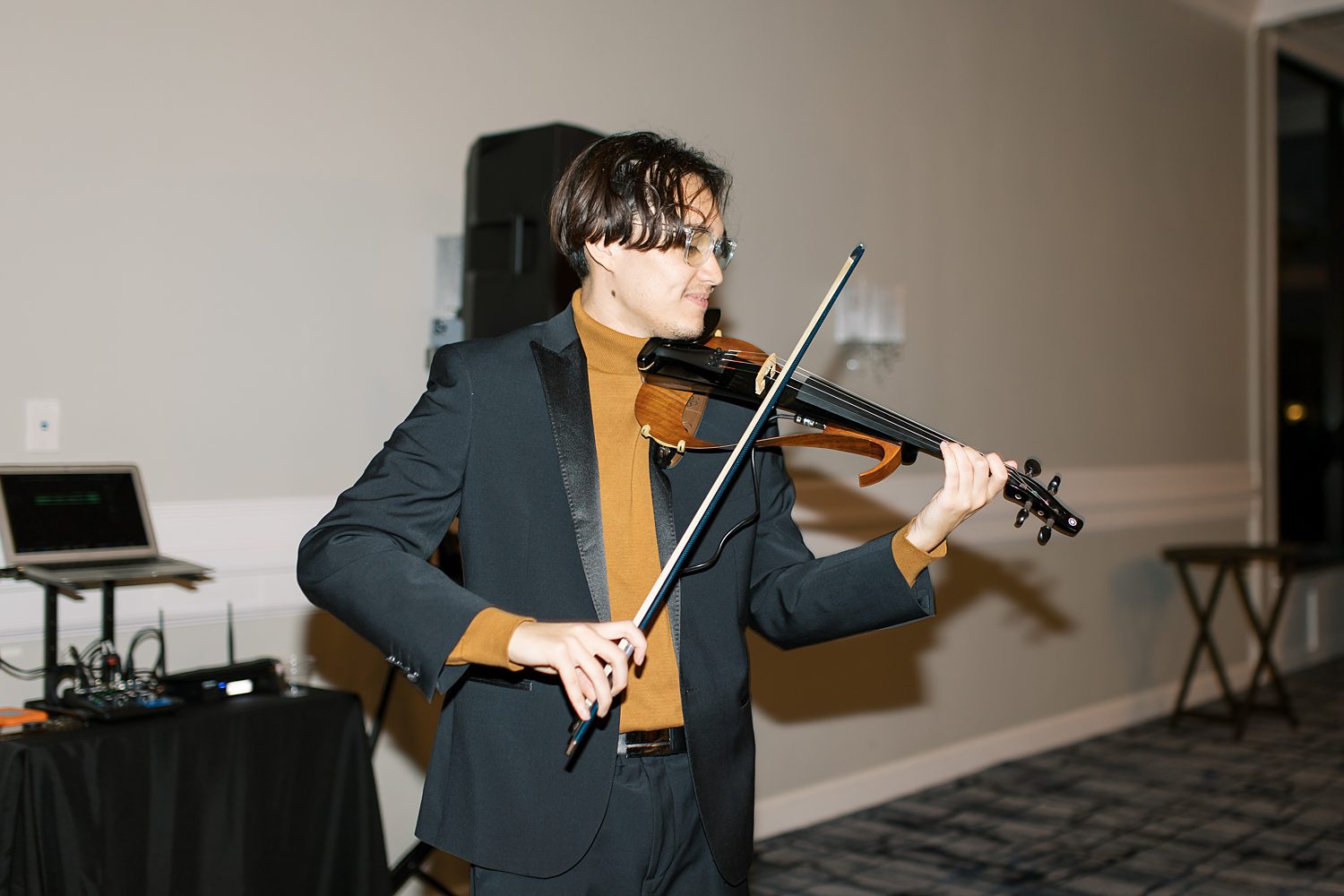 violin player performs during Rusty Pelican Tampa wedding reception