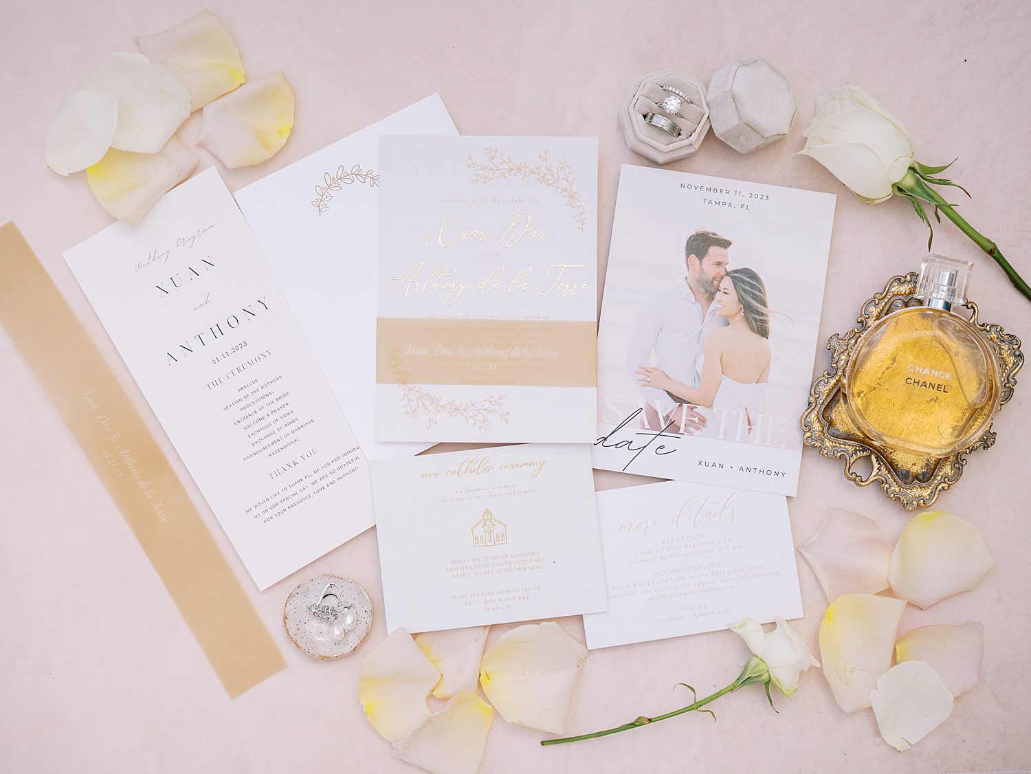 stationery suite with bride's perfume, roses, and jewelry 