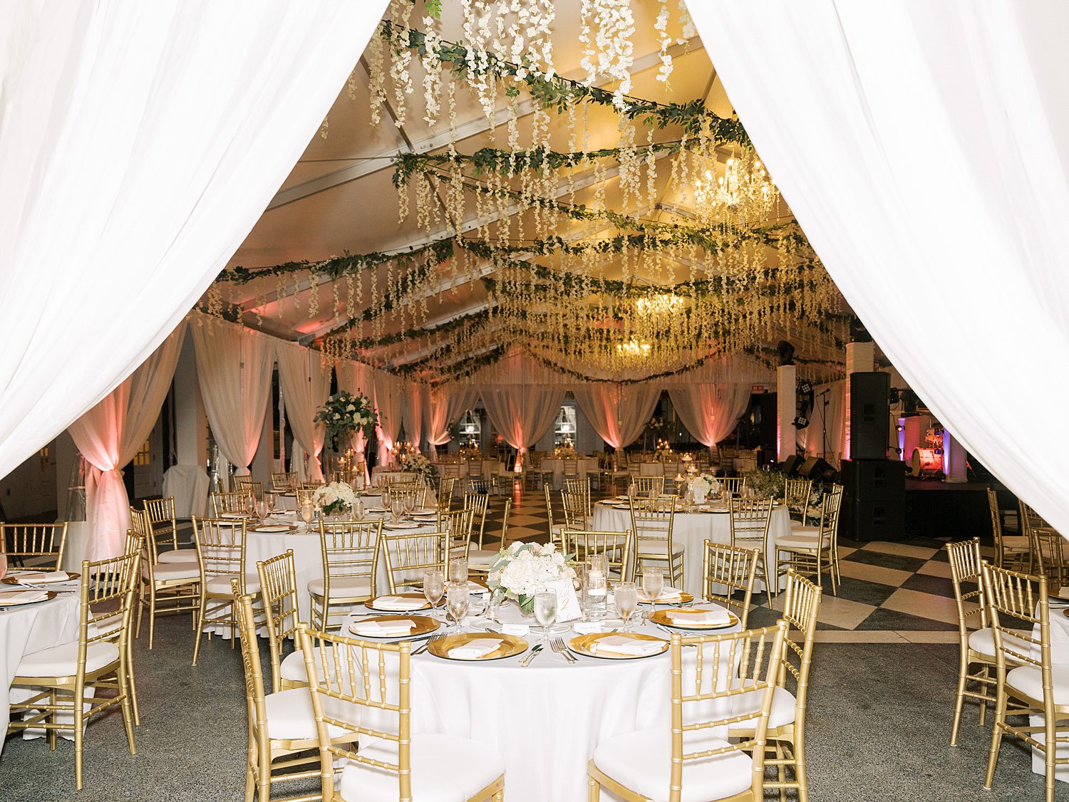 view inside tent at Tampa Yacht Club with gold and white accents 