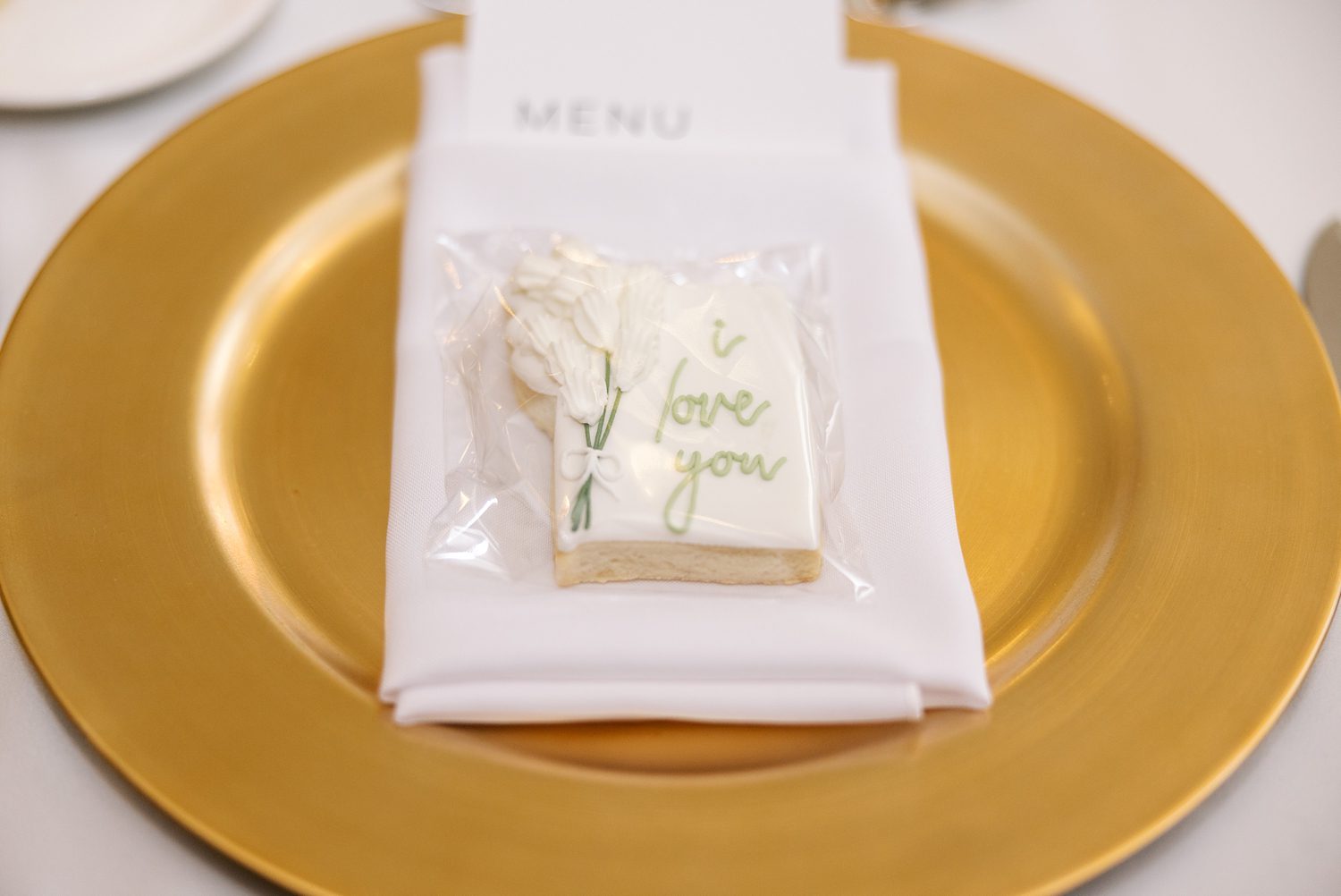 wedding reception place setting with custom cookies 