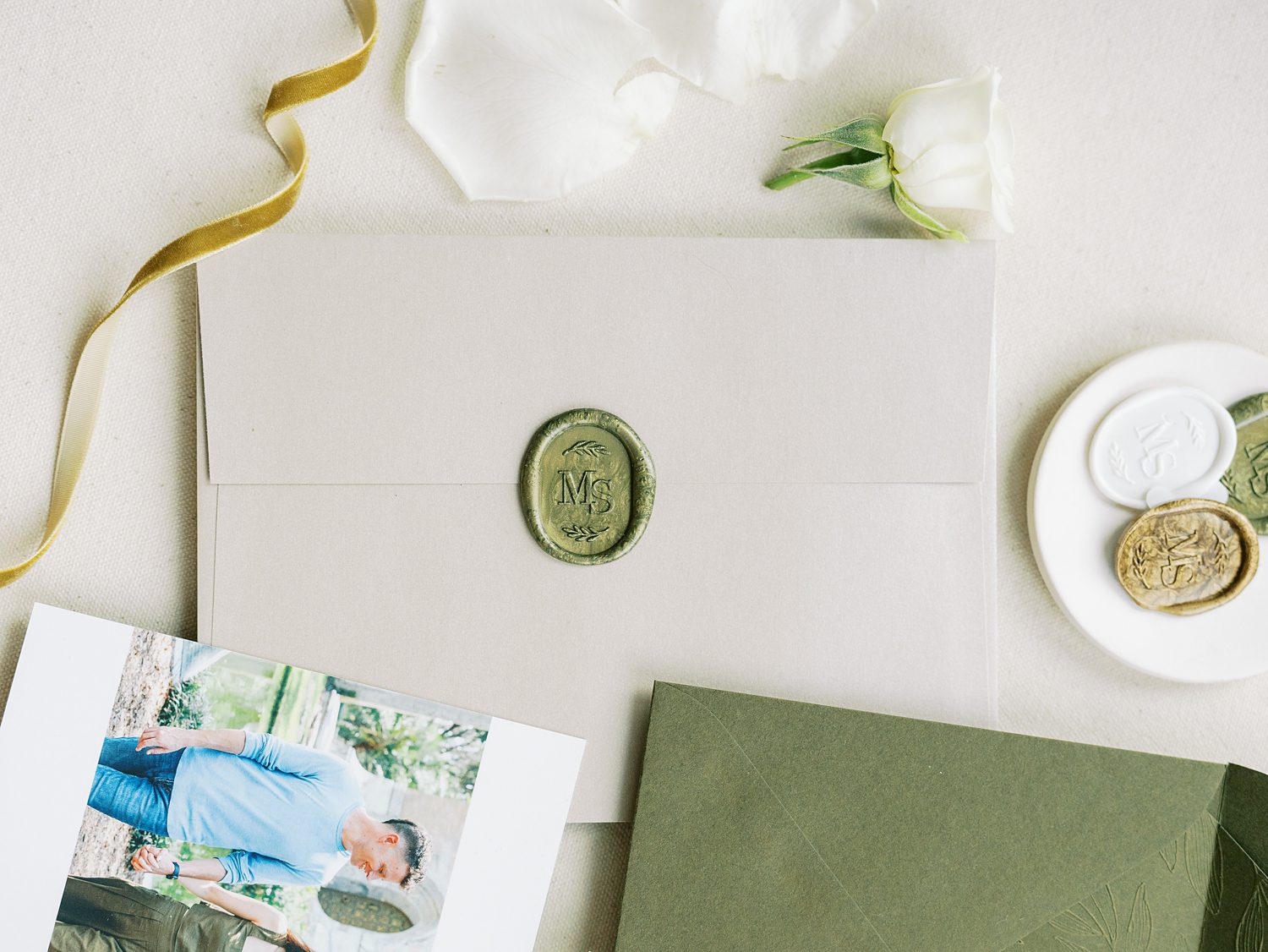 envelope with green wax seal for spring wedding at the Hotel Haya