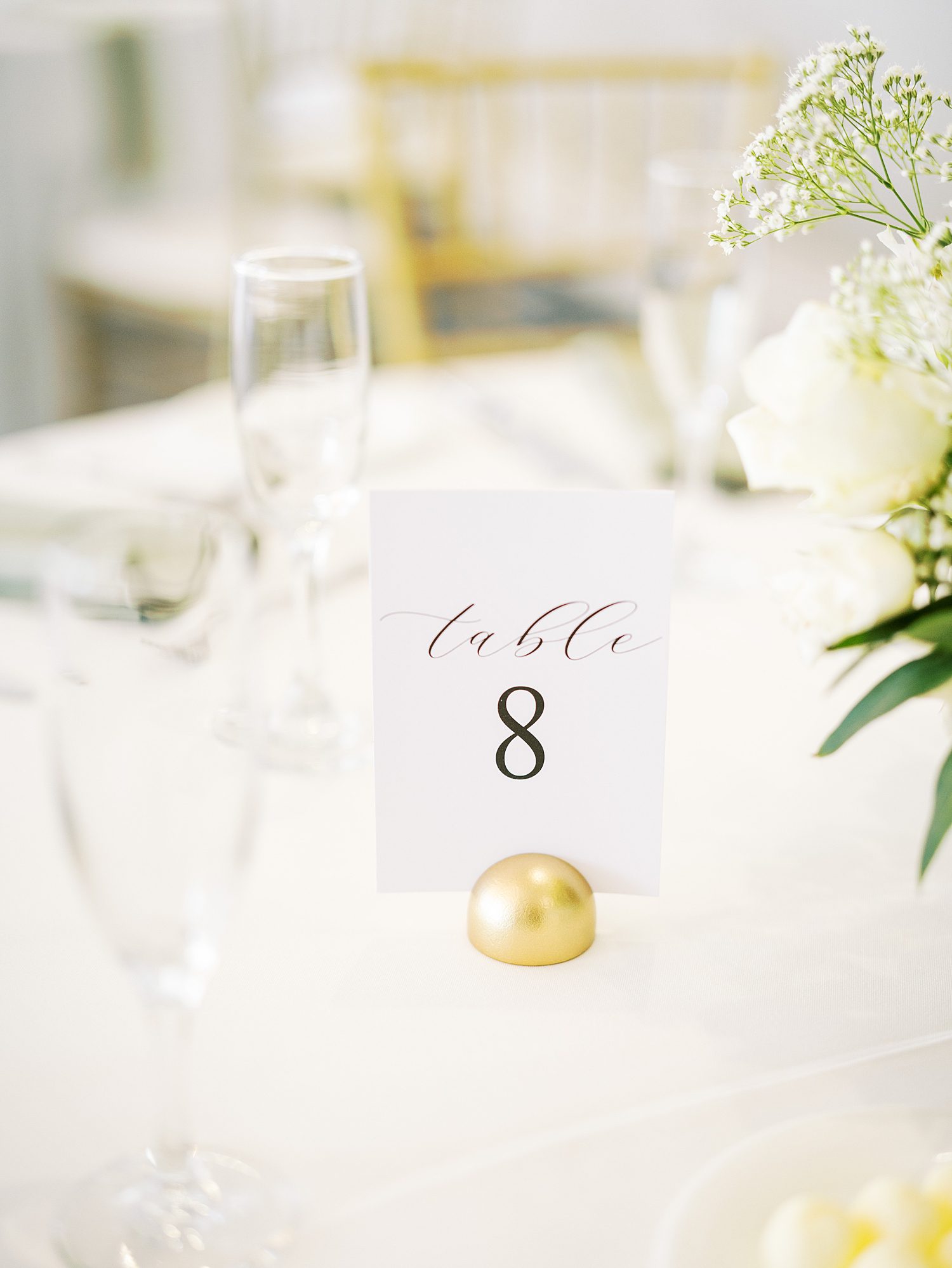 wedding reception table numbers with gold holders