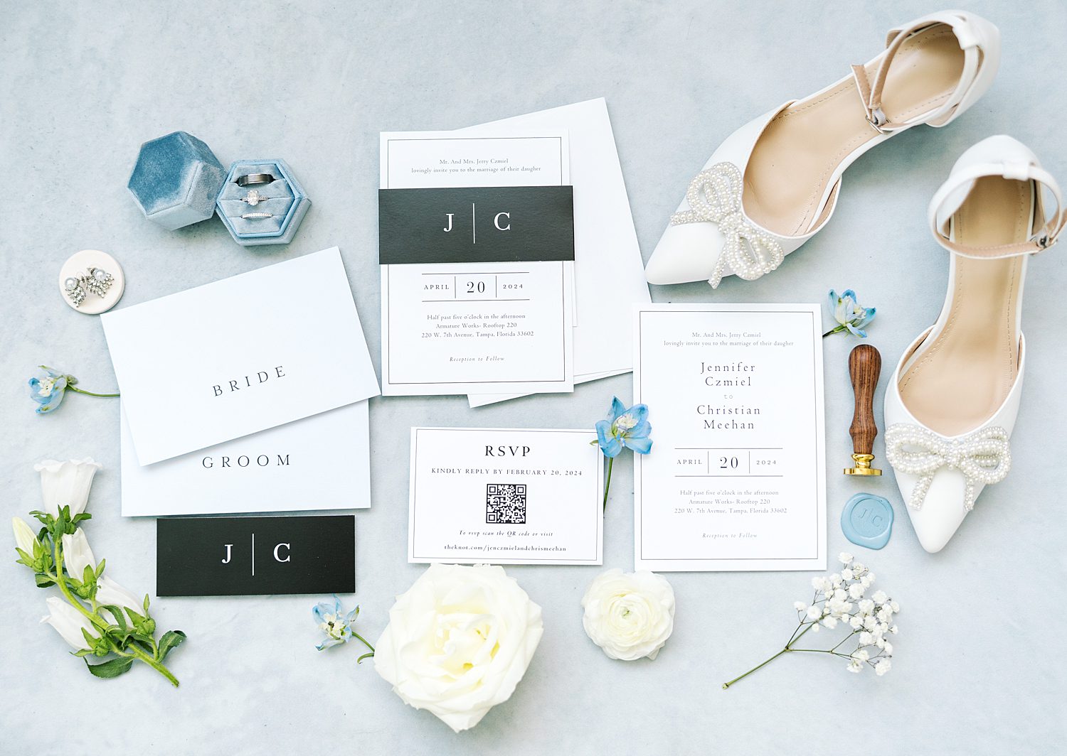 invitation suite, bride's white shoes, and jewelry for summer wedding in Tampa FL