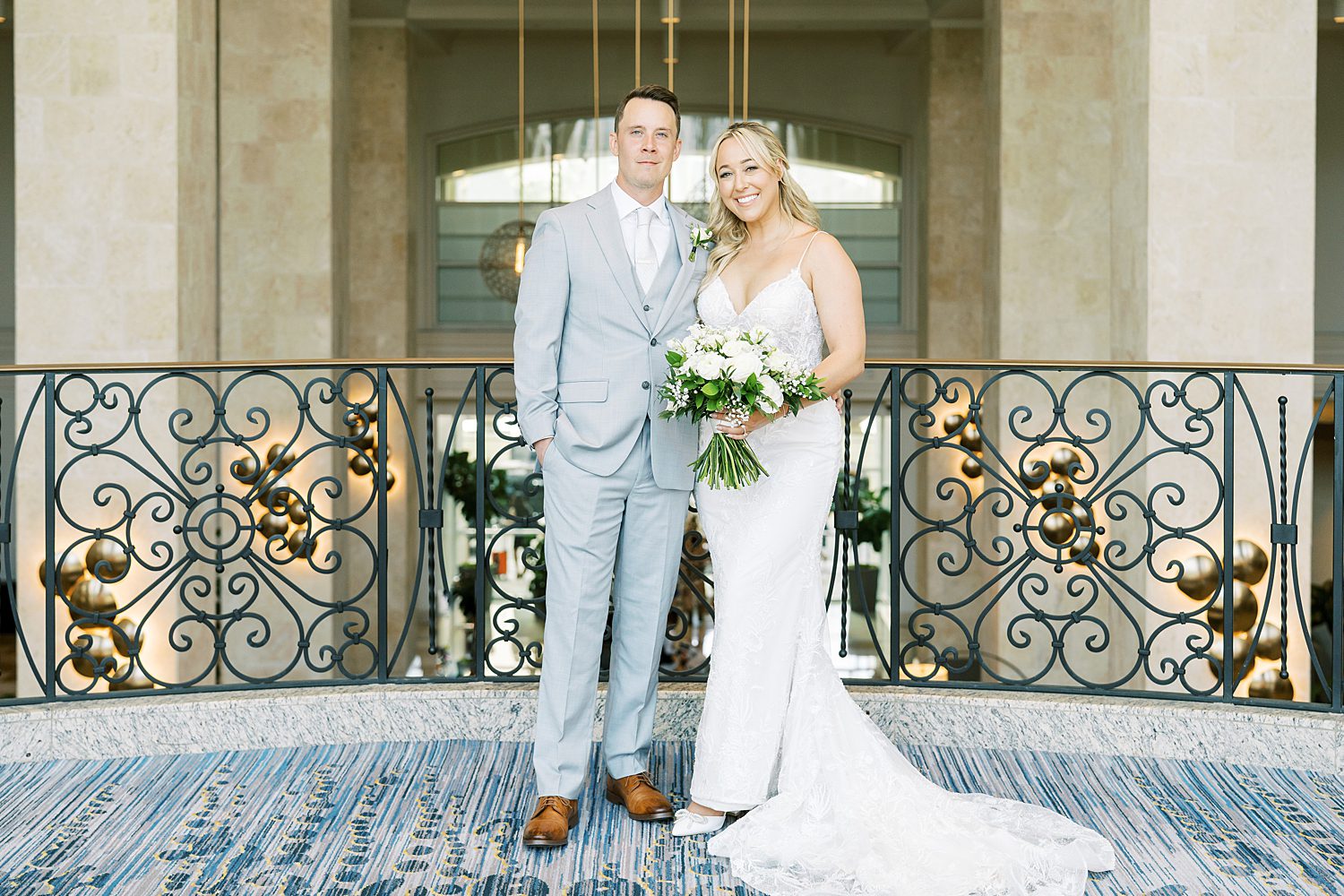 bride and groom stand on balcony of Tampa hotel