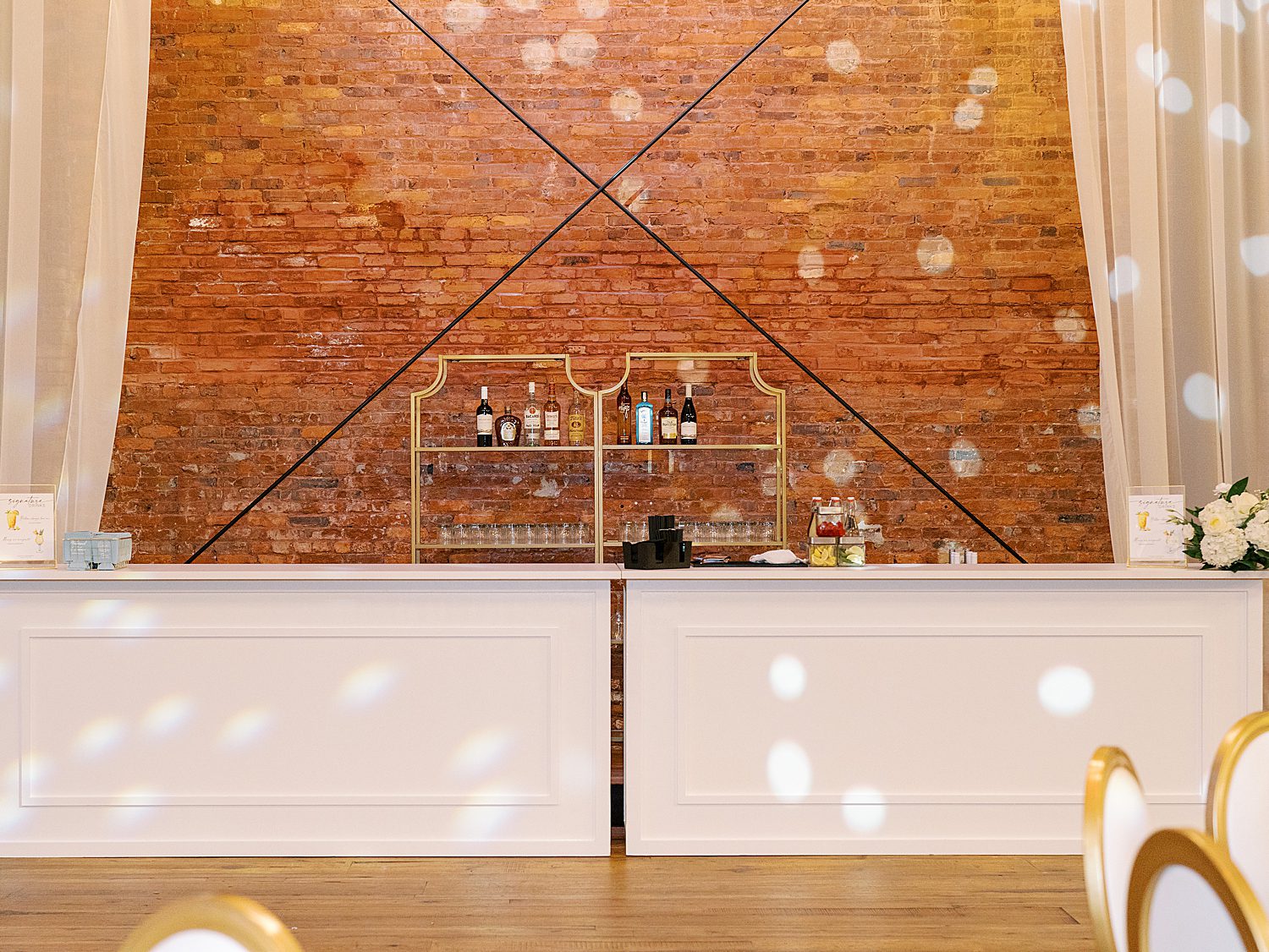 cocktail bar in front of brick wall at the Gathering space at Armature Works