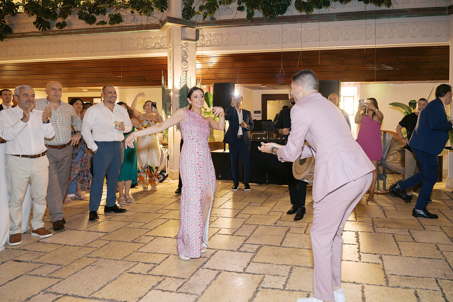 bride and groom dance in the atrium at the Mayfair Hotel