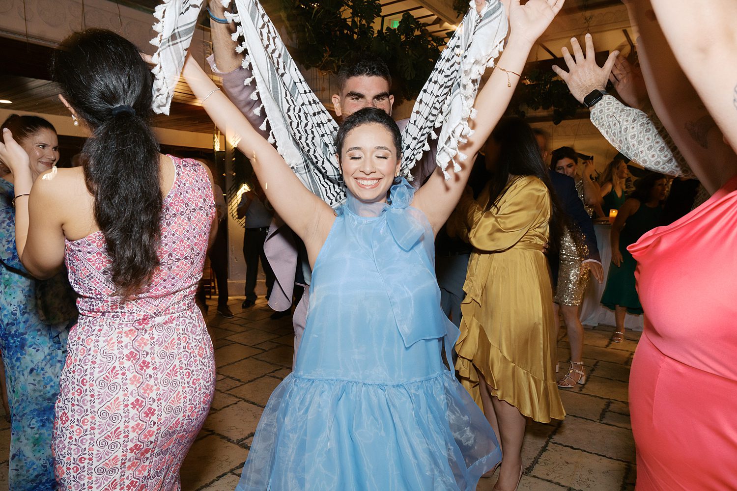 guests dance traditional dances during welome party at the Mayfair Hotel