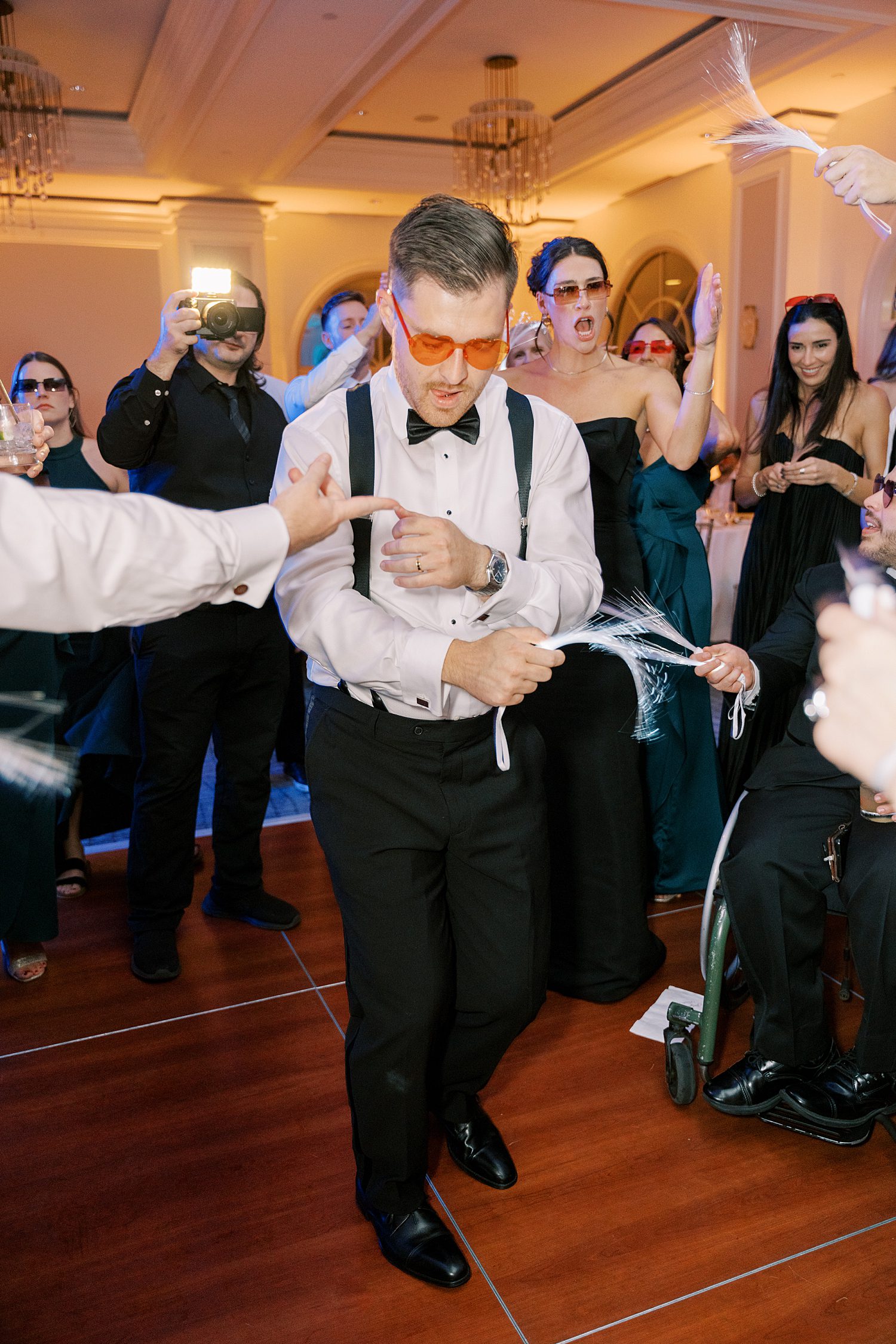 groom dances with guests at the Ritz Carlton Sarasota