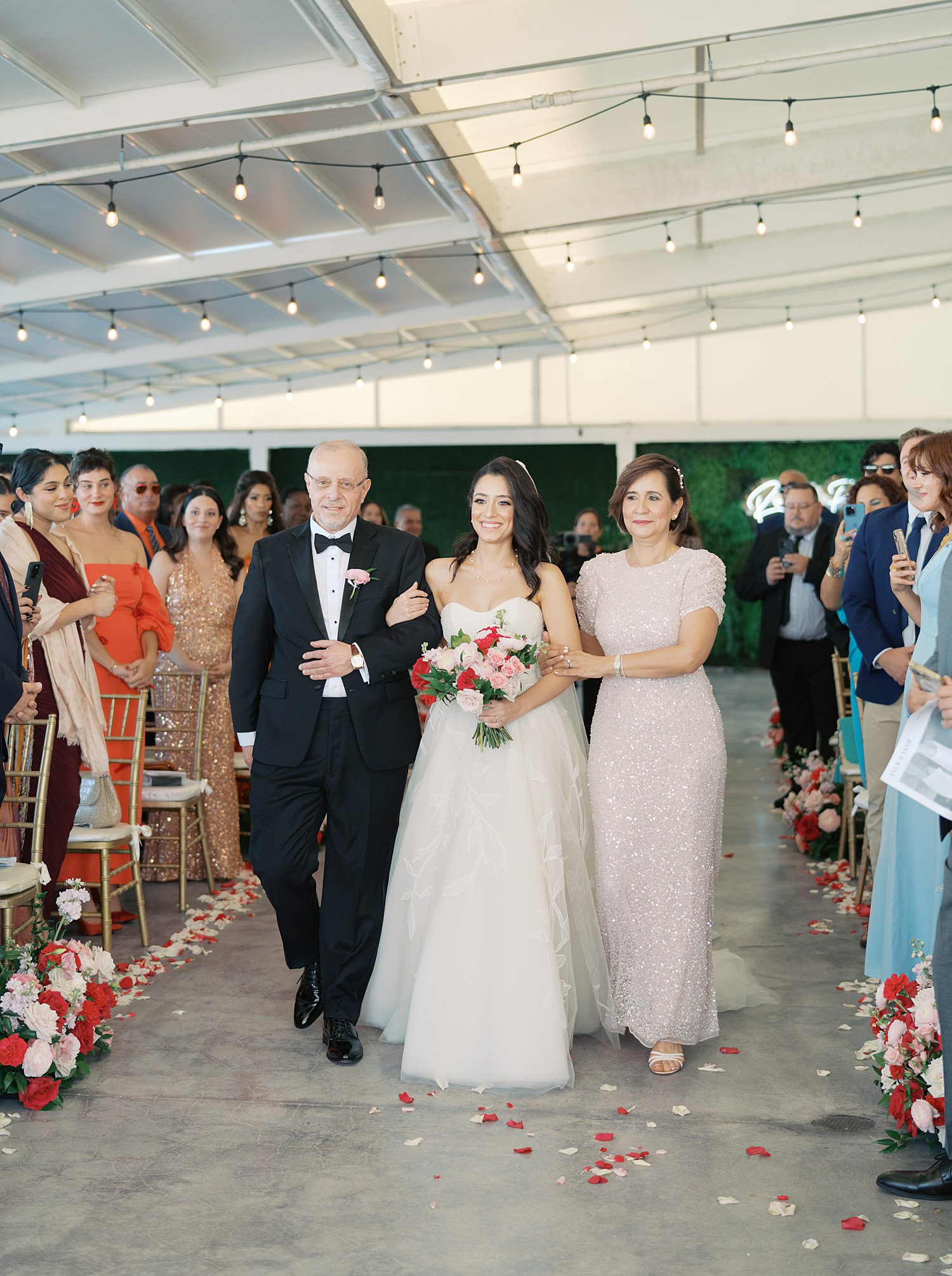 parents walk bride down aisle at the Rusty Pelican Miami