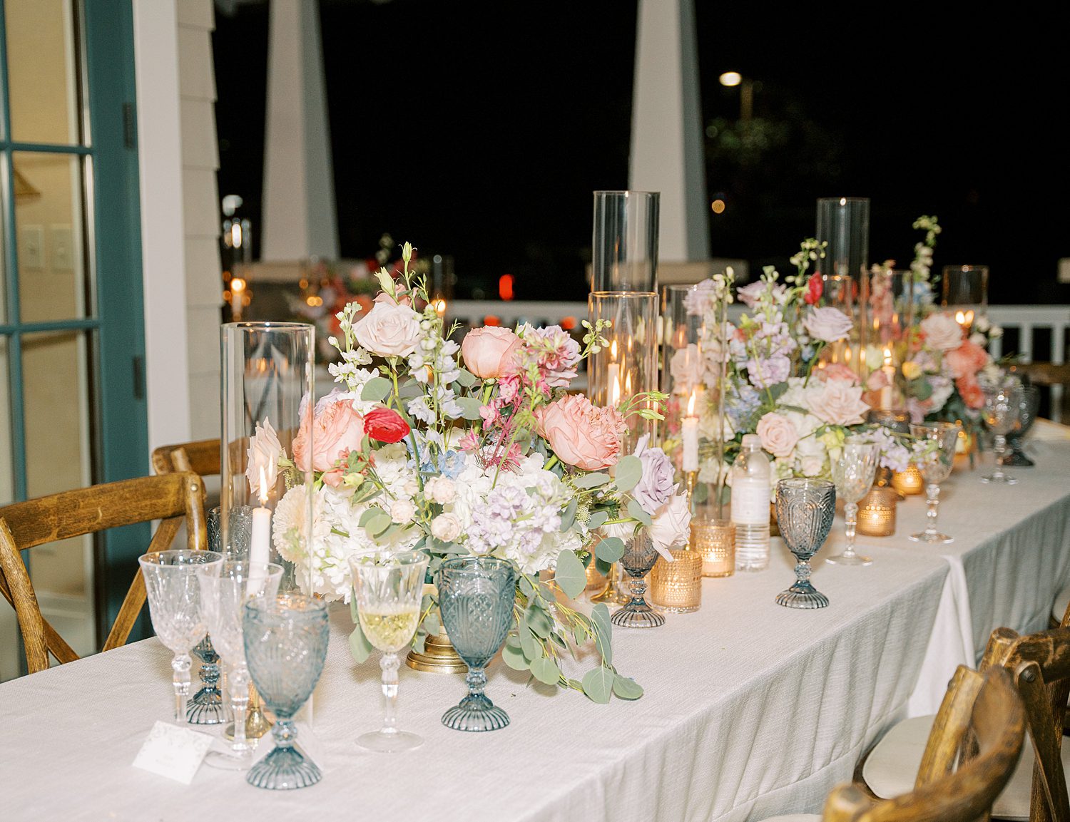 wedding reception with vintage glassware and pink and white flowers